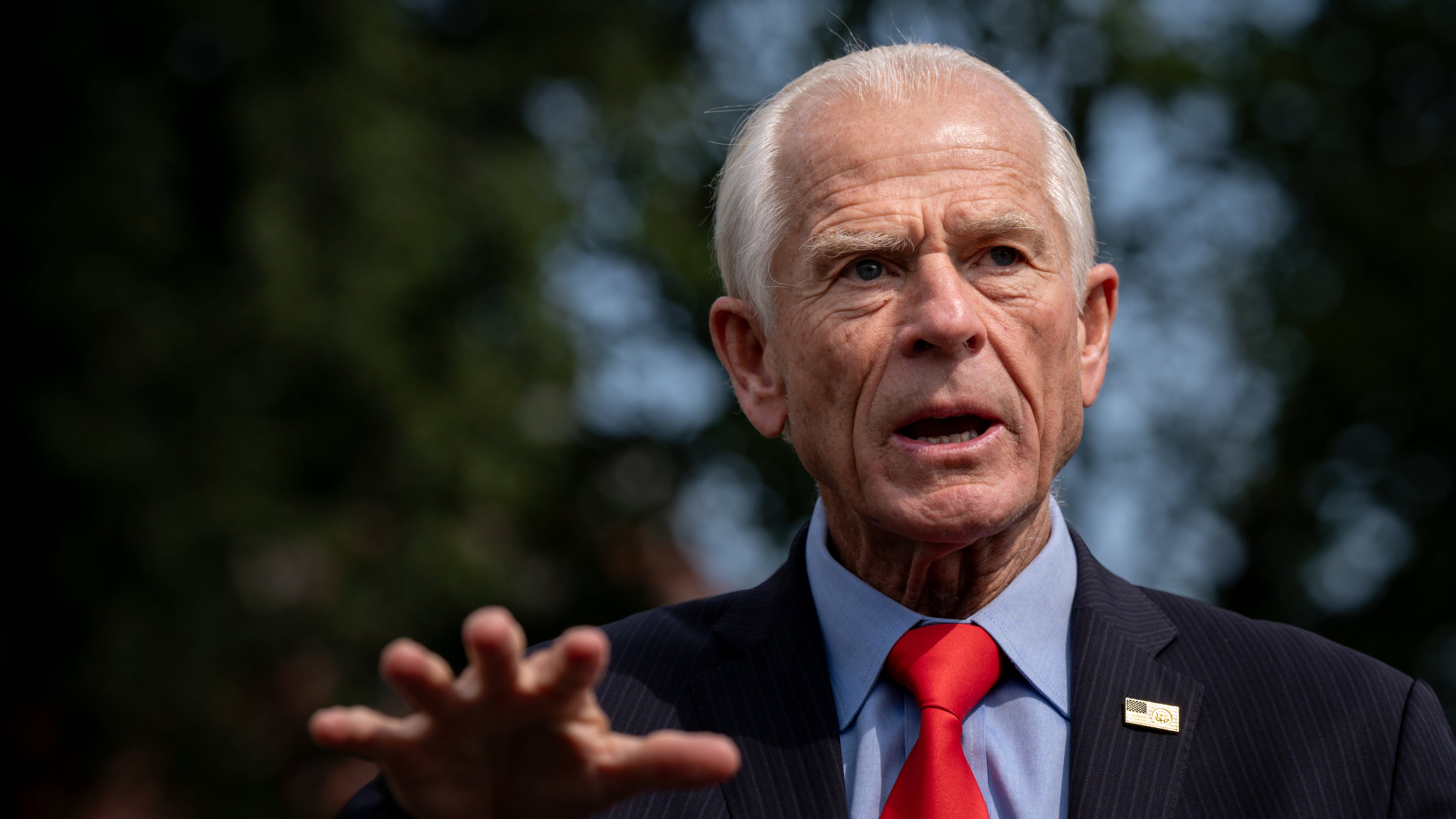 White House trade counselor Peter Navarro speaks with reporters following a video interview with Real America's Voice News, Tuesday, Aug. 11, 2026, outside the White House in Washington. (AP Photo/Julia Demaree Nikhinson)