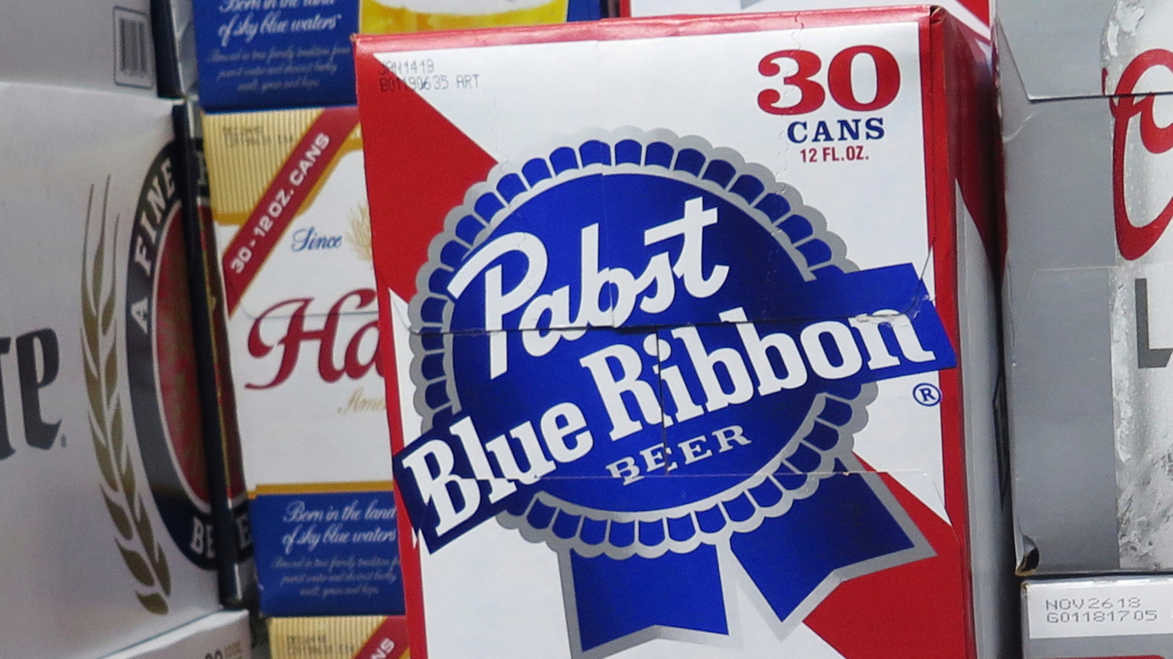 FILE - Cases of Pabst Blue Ribbon beer are stacked in a liquor store, Nov. 8, 2018, in Milwaukee. (AP Photo/Ivan Moreno, File)