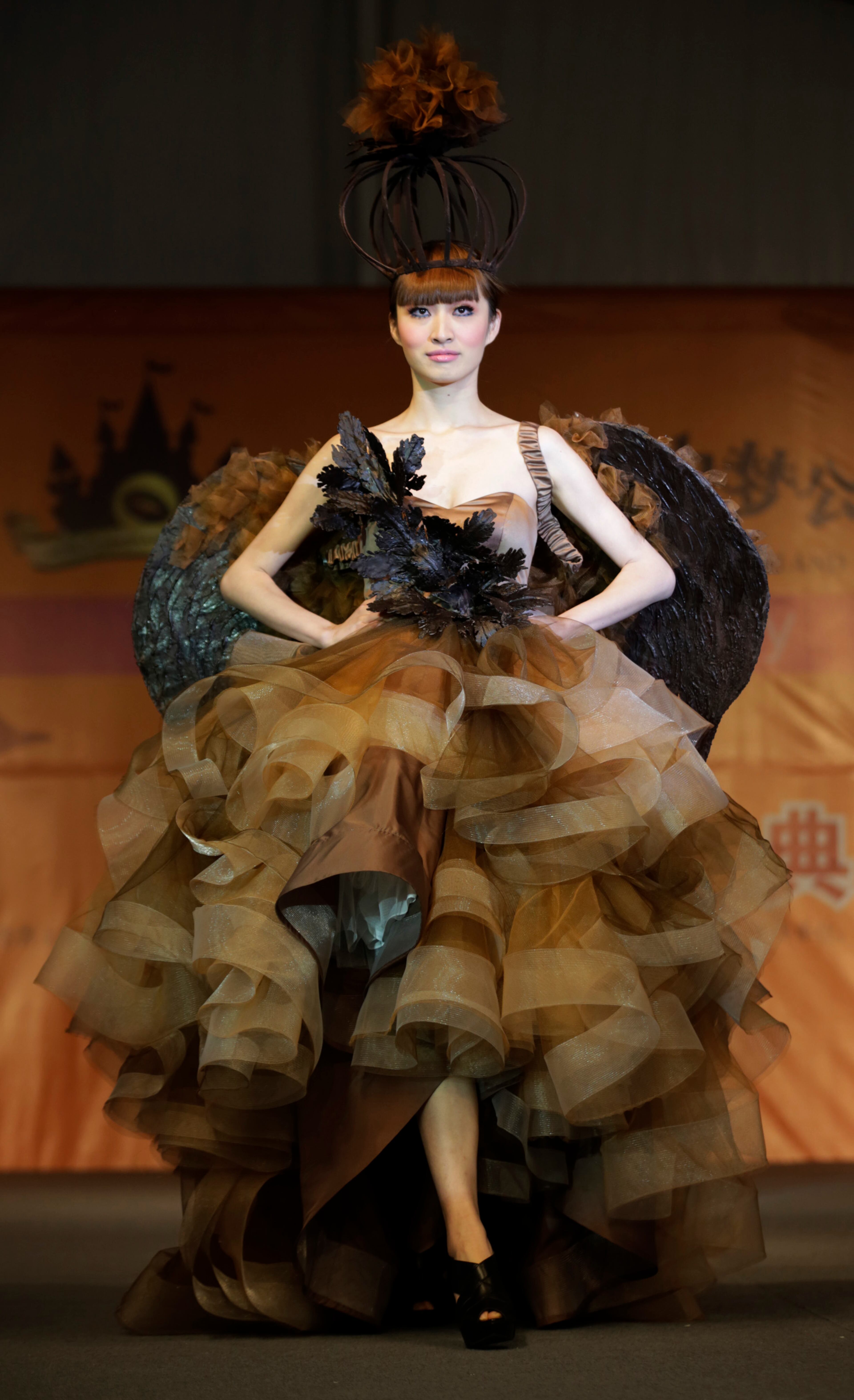 A model displays a dress partially made of chocolate during a chocolate fashion show in Shanghai, China, on Thursday, Jan. 17, 2013.
