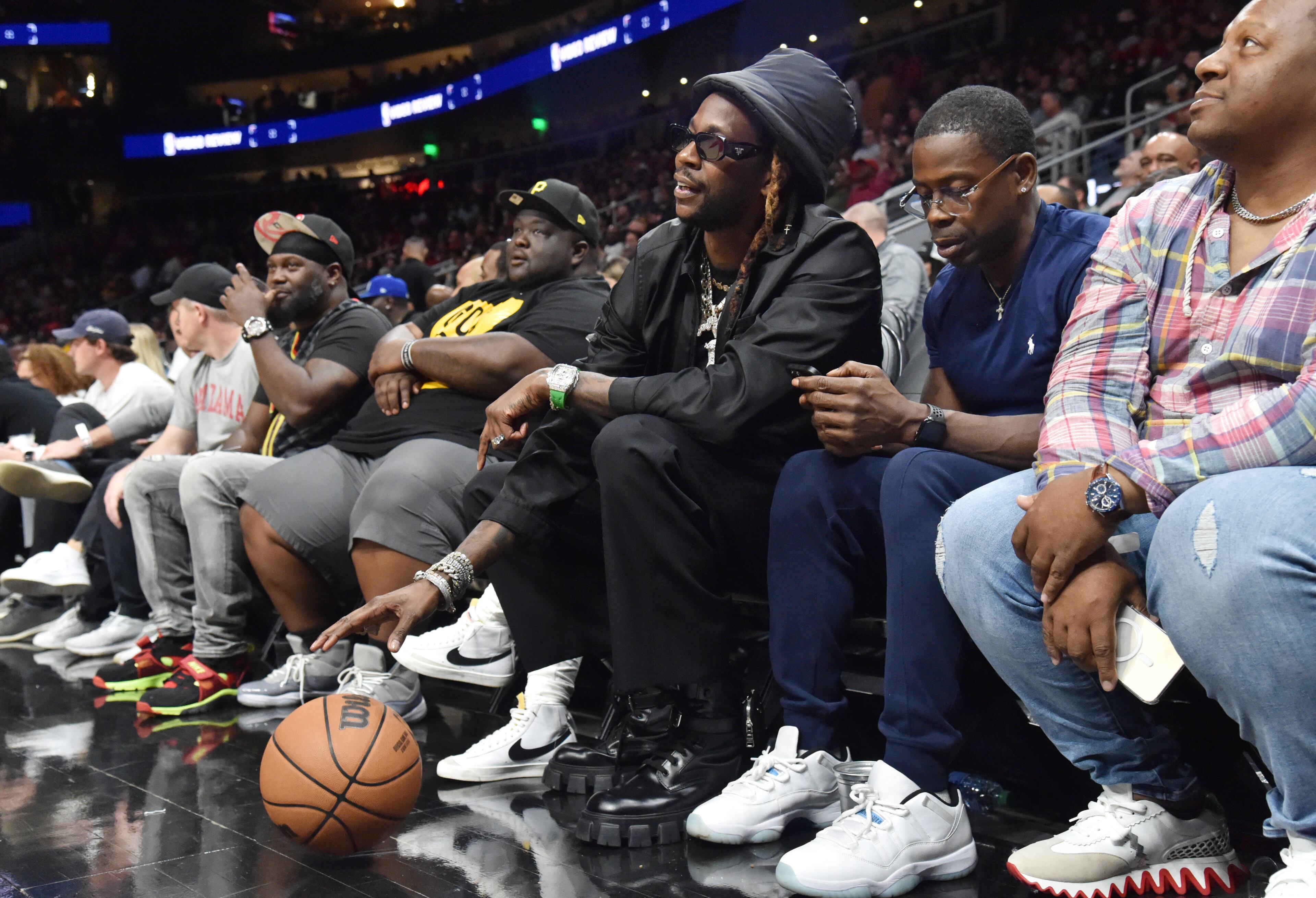 Rapper 2 Chainz dribbles a ball during the second half in an NBA basketball game at State Farm Arena on Thursday, March 31, 2022. Atlanta Hawks won 131-107 over Cleveland Cavaliers. (Hyosub Shin / Hyosub.Shin@ajc.com)