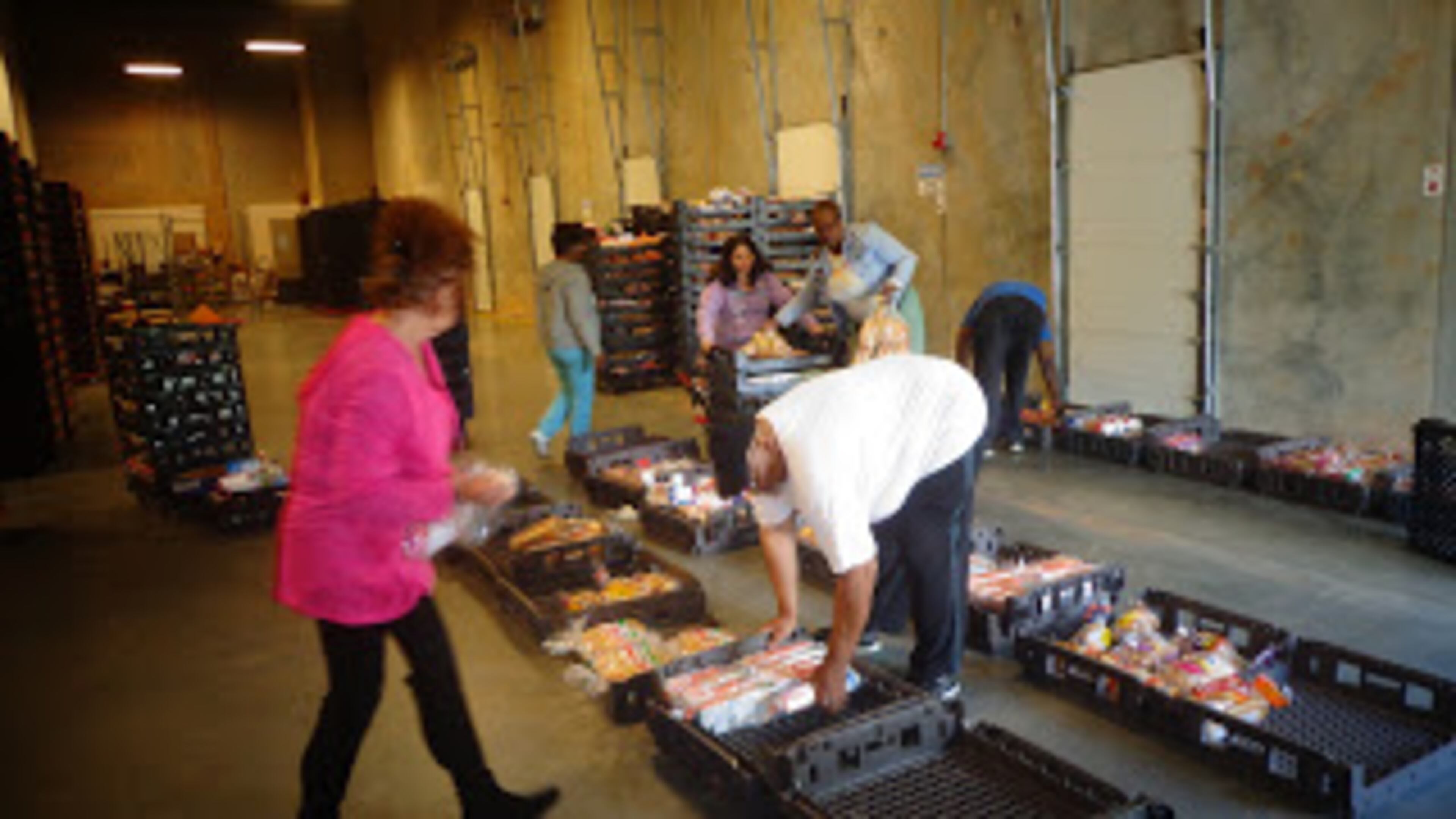 Volunteers help at the food pantry at Daily Bread for All. CONTRIBUTED