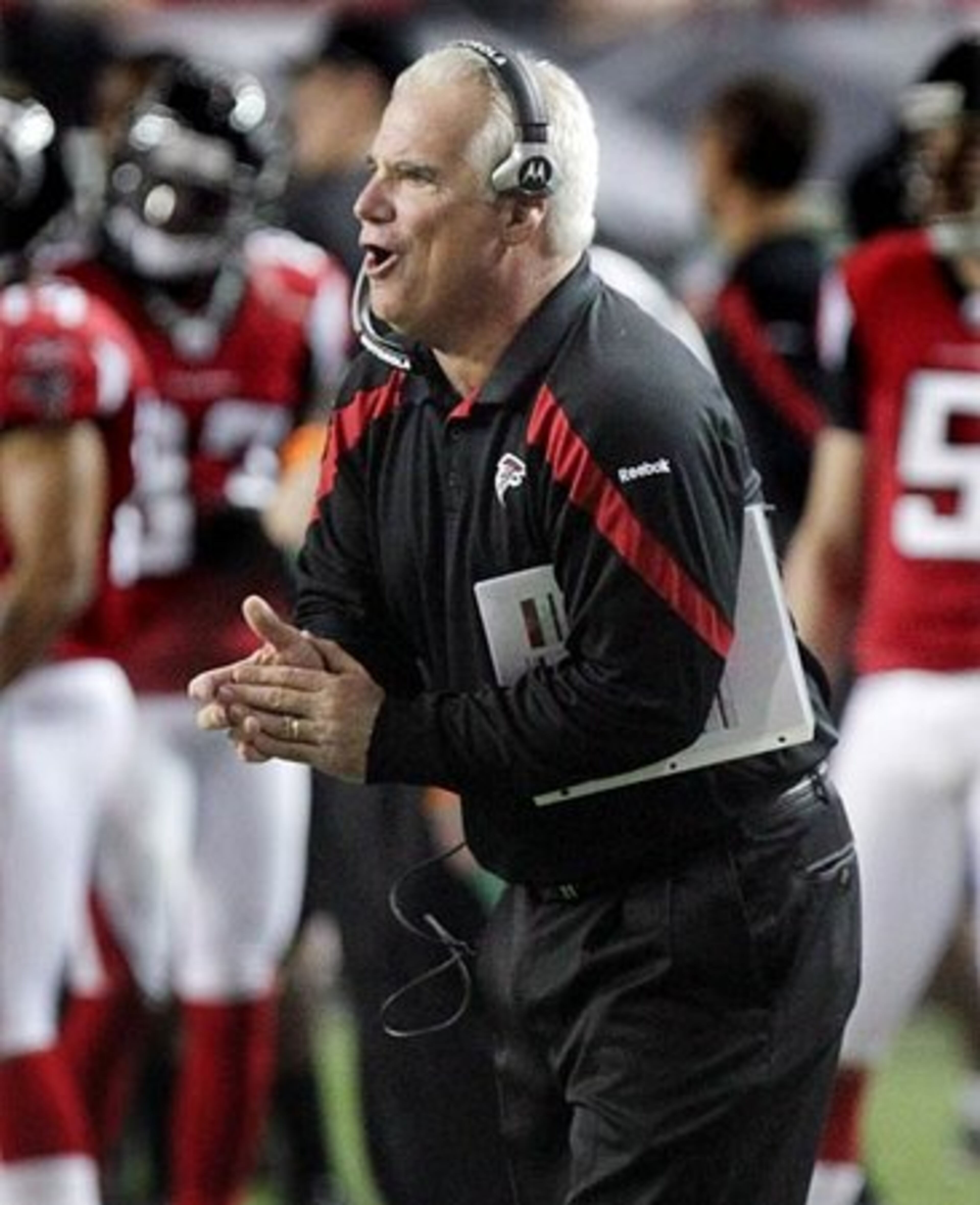 A different week and a different result as Falcons head coach Mike Smith applaudes his team for picking up the first down on a 4th down and 1 attempt against the Titans during 2nd half action.