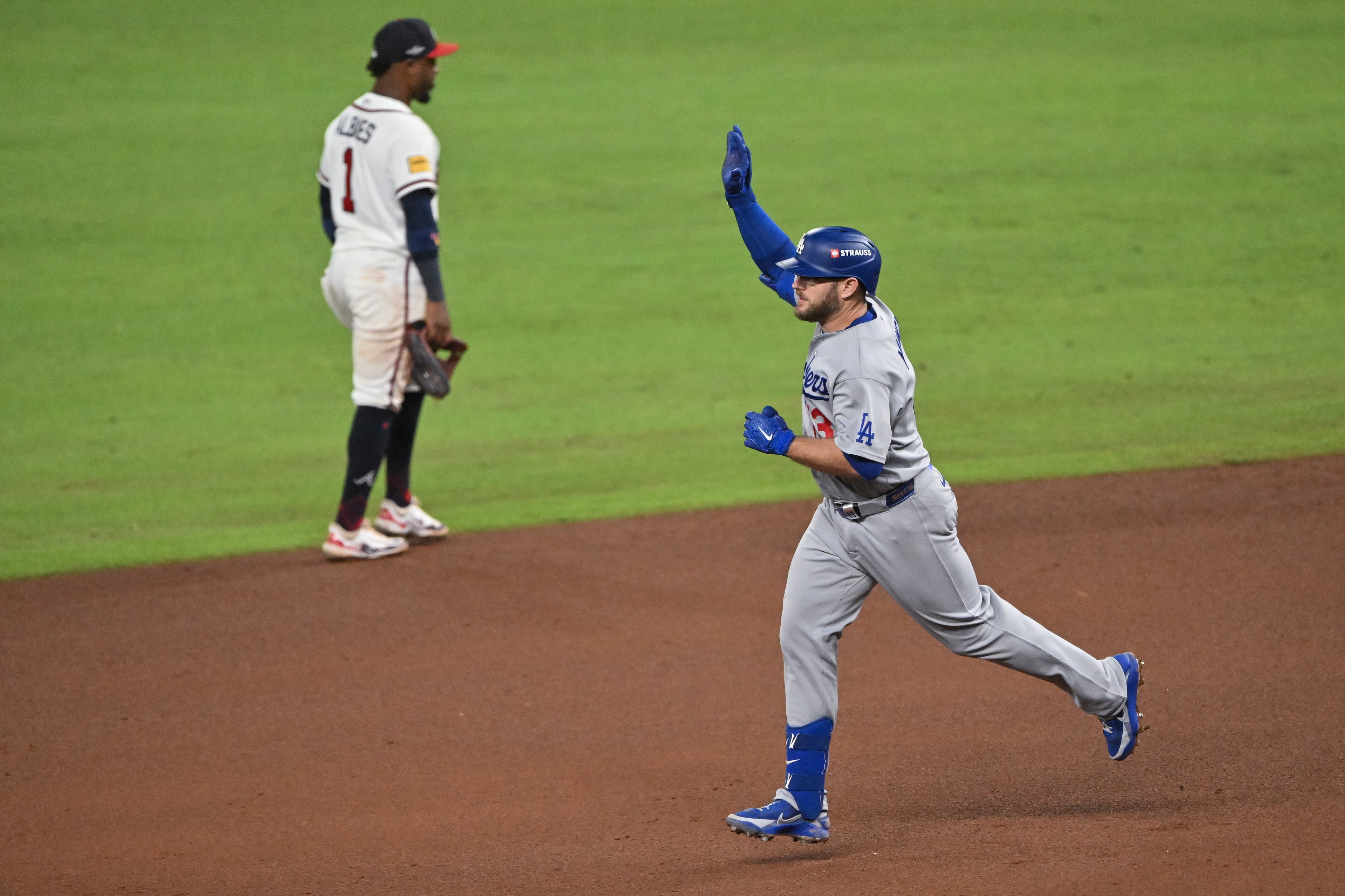 Los Angeles Dodgers' Max Muncy (13) reacts after hitting a solo home run against the Atlanta Braves during the ninth inning of Game 4 of the MLB National League Division Series between the Atlanta Braves and the Los Angeles Dodgers, Wednesday, Oct. 7, 2026, in Atlanta. (Hyosub Shin/AJC)