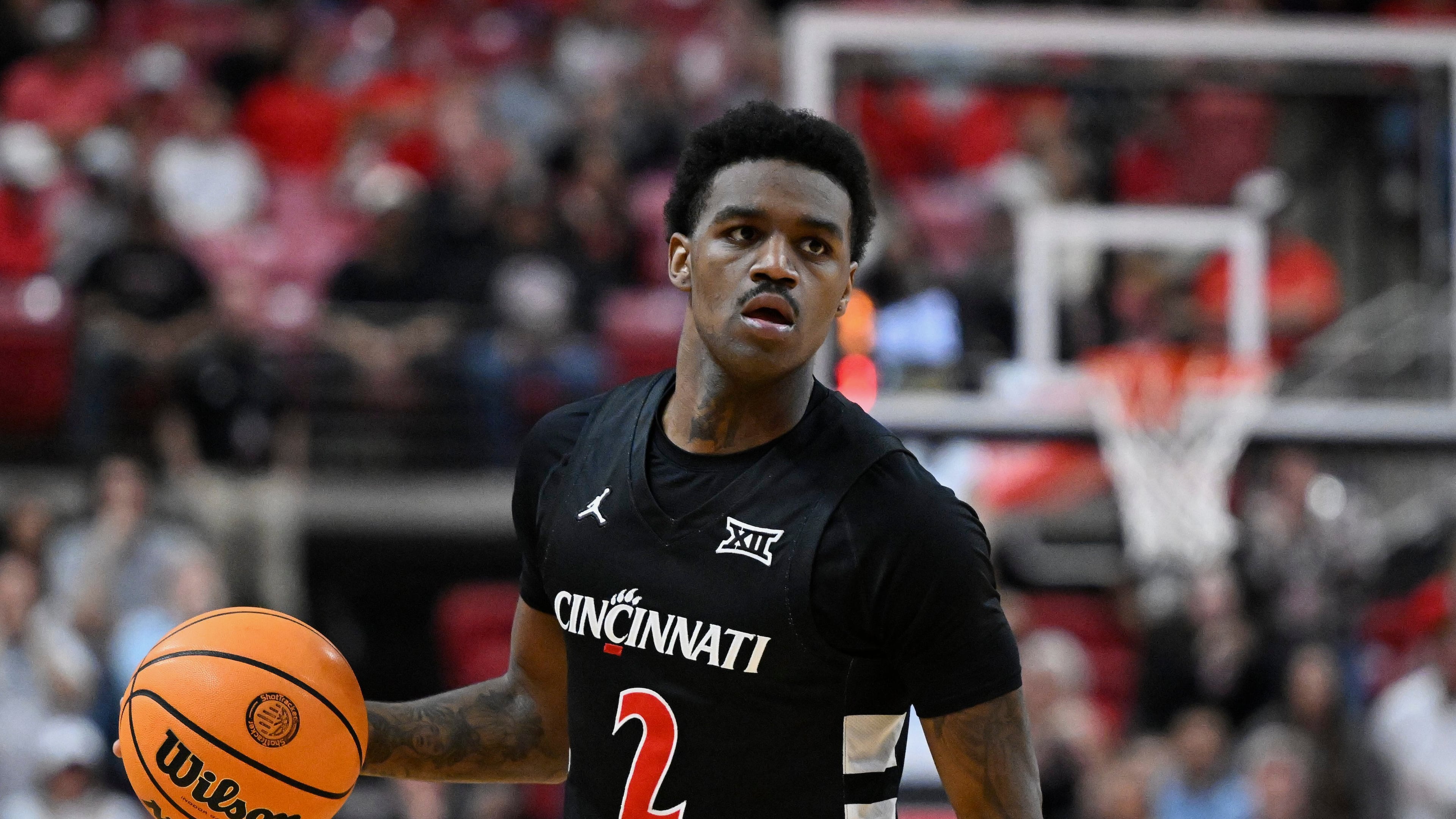 FILE - Cincinnati guard Jizzle James (2) brings the ball up court against Texas Tech during the second half of an NCAA college basketball game on Feb. 24, 2026, in Lubbock, Texas. (AP Photo/Justin Rex, File)