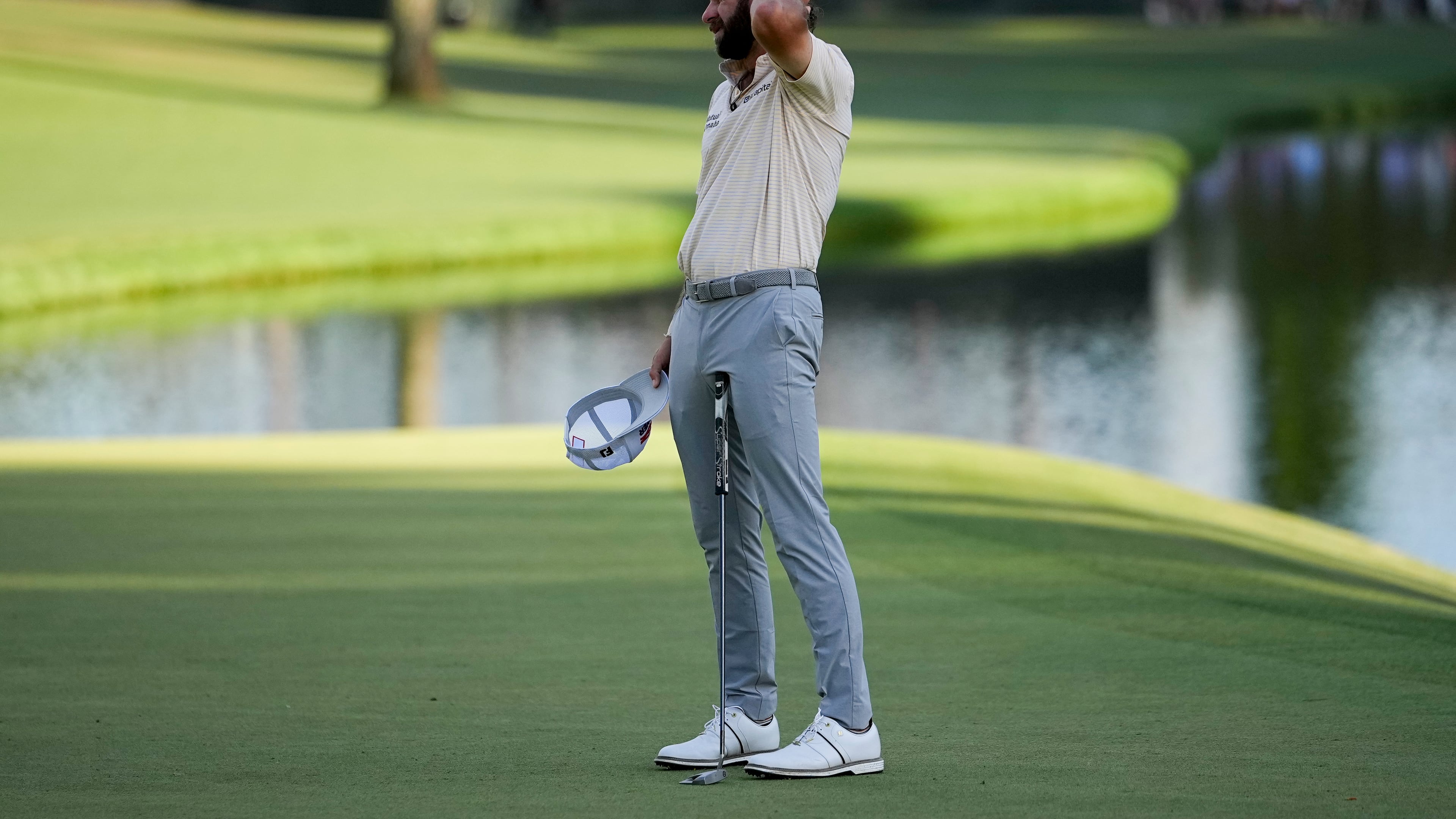Cameron Young reacts after missing a putt on the 16th hole during the final round of the Masters golf tournament at the Augusta National Golf Club, Sunday, April 12, 2026, in Augusta, Ga. (AP Photo/Gerald Herbert)