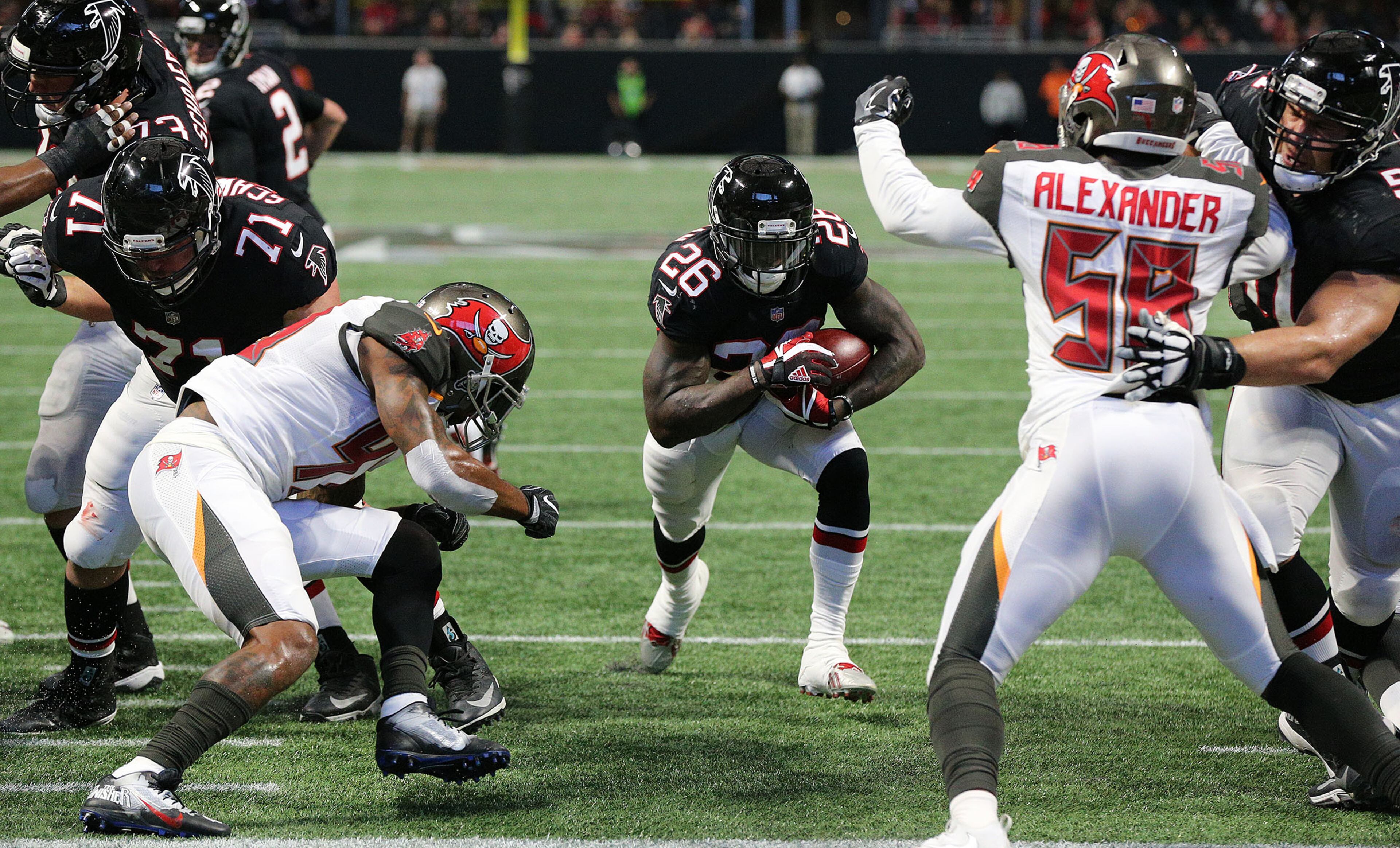 November 26, 2017 Atlanta: Falcons running back Tevin Coleman rushes for his first of two second half touchdowns to take a 27-6 lead over the Buccaneers during the third quarter in a NFL football game on Sunday, November 26, 2017, in Atlanta. Curtis Compton/ccompton@ajc.com