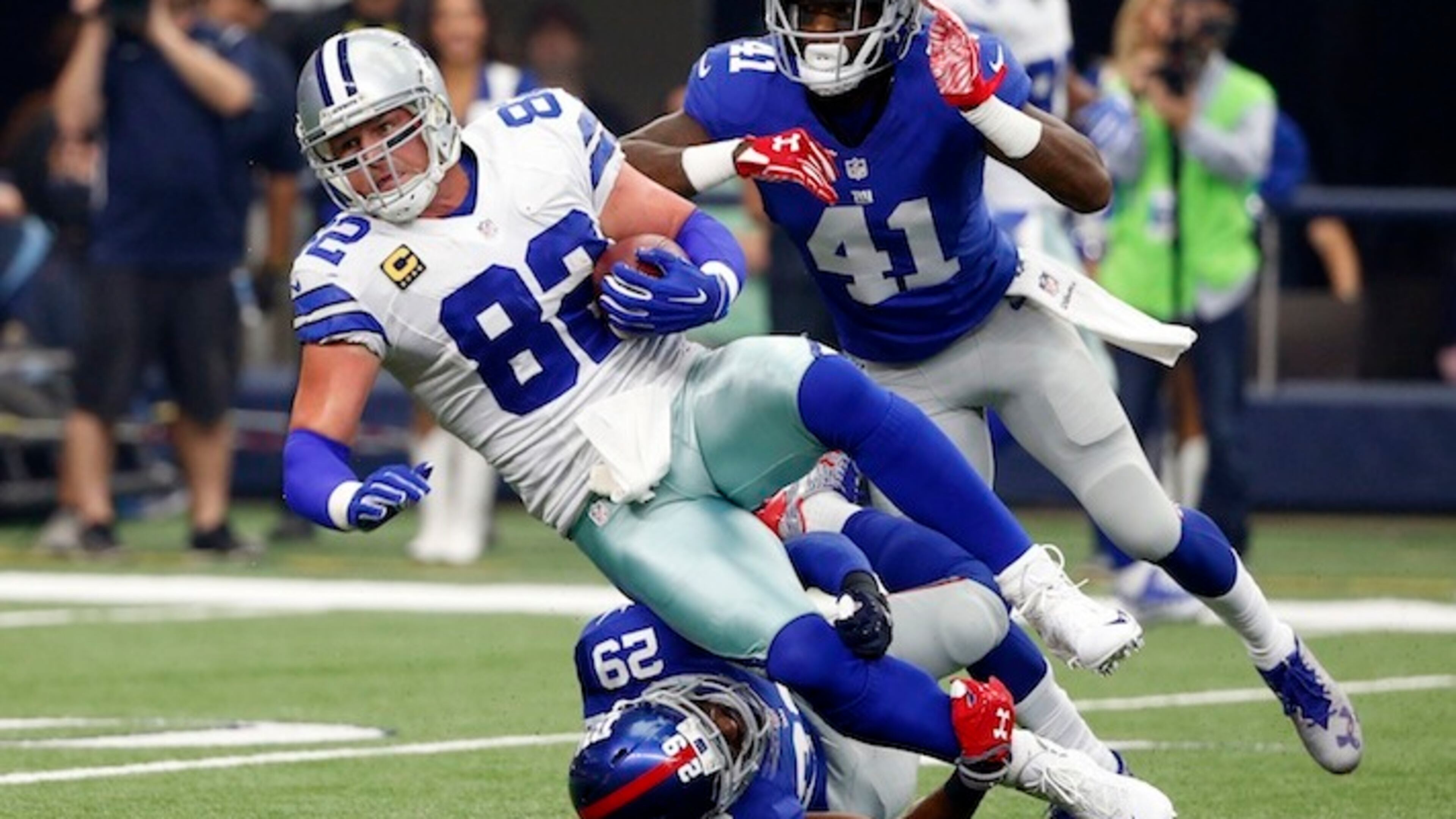 Dallas Cowboys tight end Jason Witten (82) is tackled after a catch by New York Giants free safety Landon Collins (21) and cornerback Dominique Rodgers-Cromartie (41) during an NFL football game on Sunday, Sept. 11, 2016, in Arlington, Texas. (AP Photo/Michael Ainsworth)