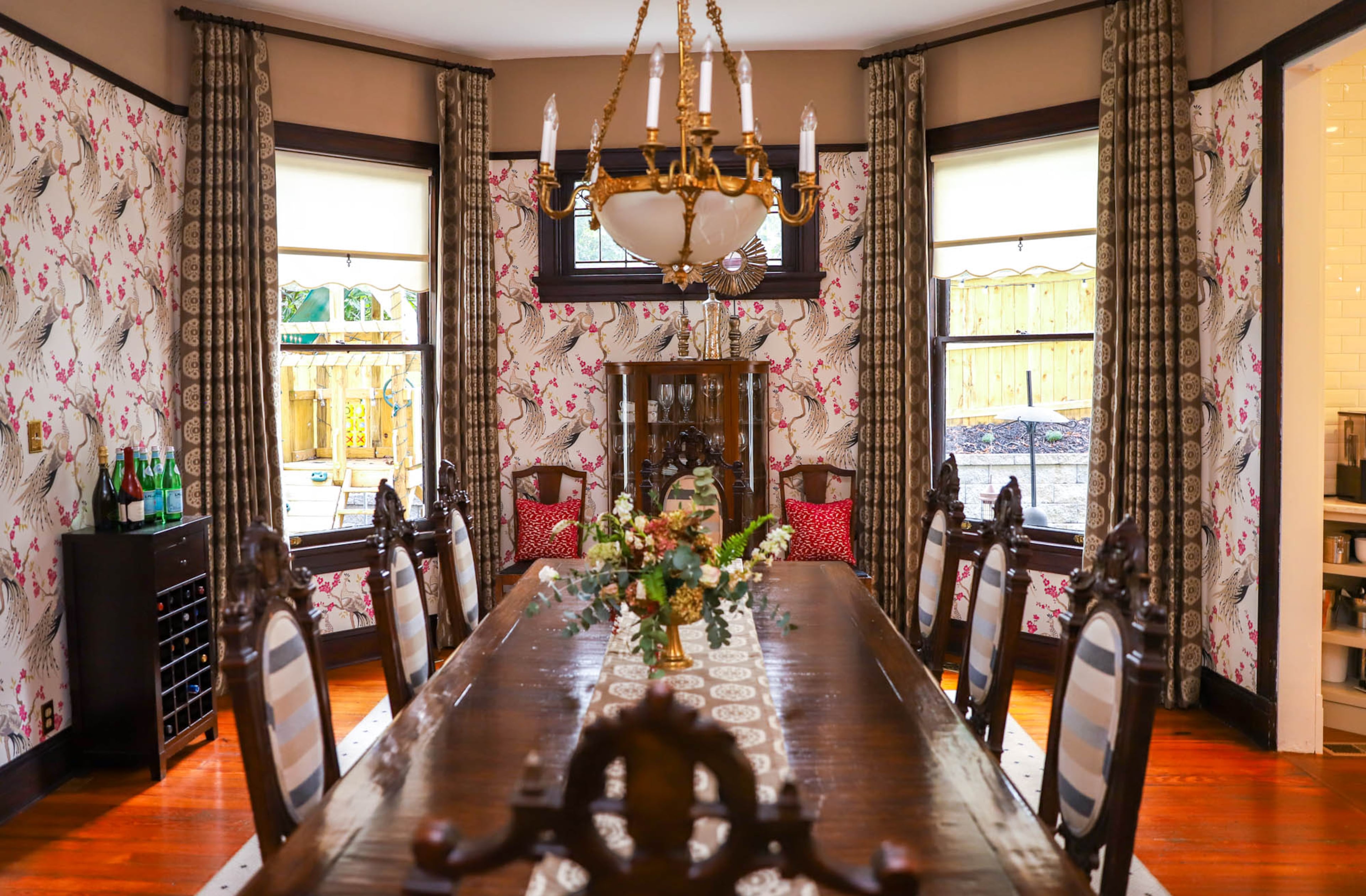 After searching for the right chairs to go with the dining room table, the Goves found a match at Scott Antique Market. Interior designer Michele Gratch showed Brittney Gove the pink peacock wallpaper from Clarke & Clarke, and it was an immediate yes, Gove said. Drapery from Thibaut softens the edges of the mural-like walls.