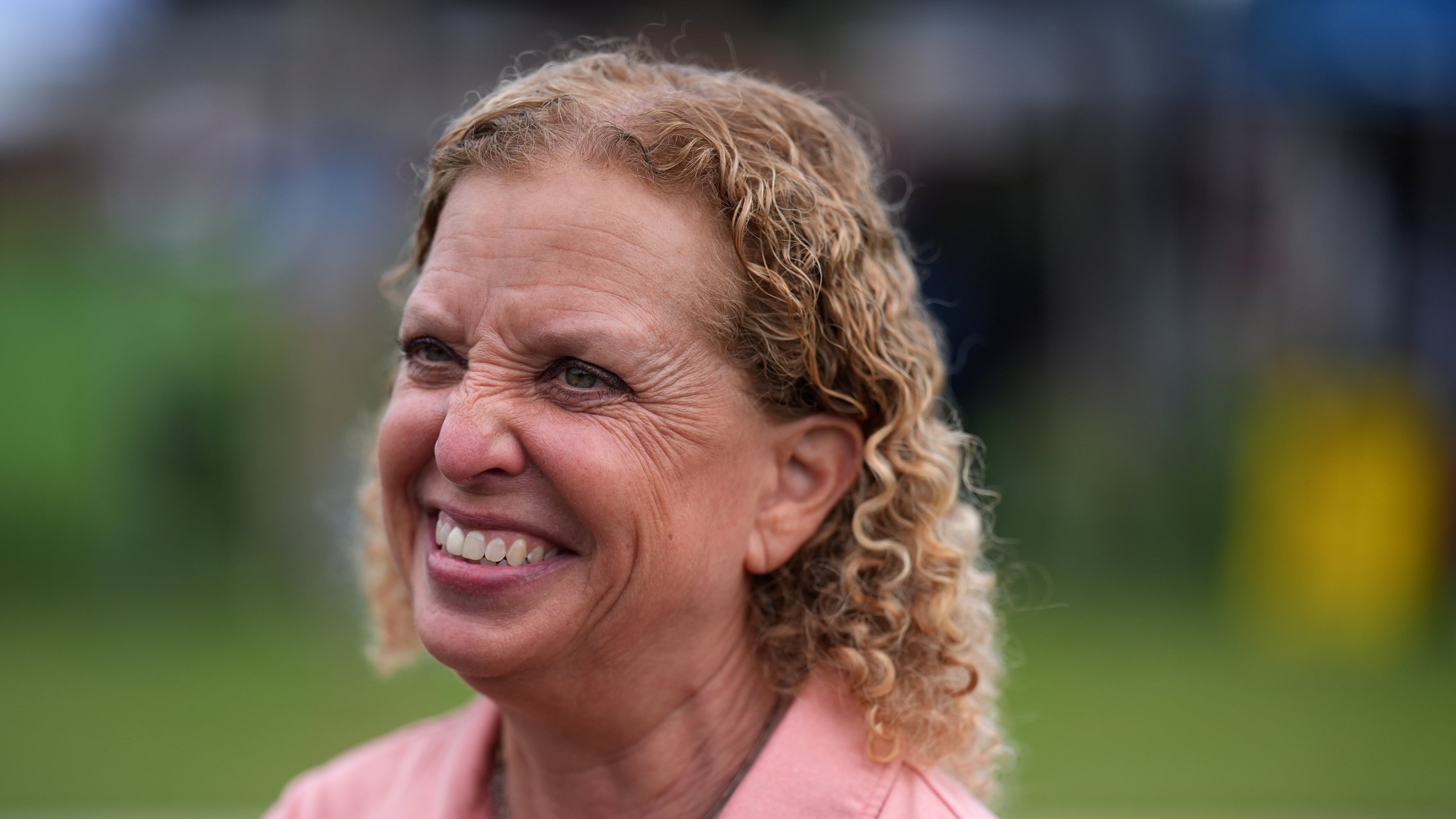 U.S. Rep. Debbie Wasserman Schultz smiles as she greets constituents at a National Night Out community event while campaigning for Florida's 20th congressional district, in Plantation, Fla., Tuesday, Aug. 4, 2026. (AP Photo/Rebecca Blackwell)