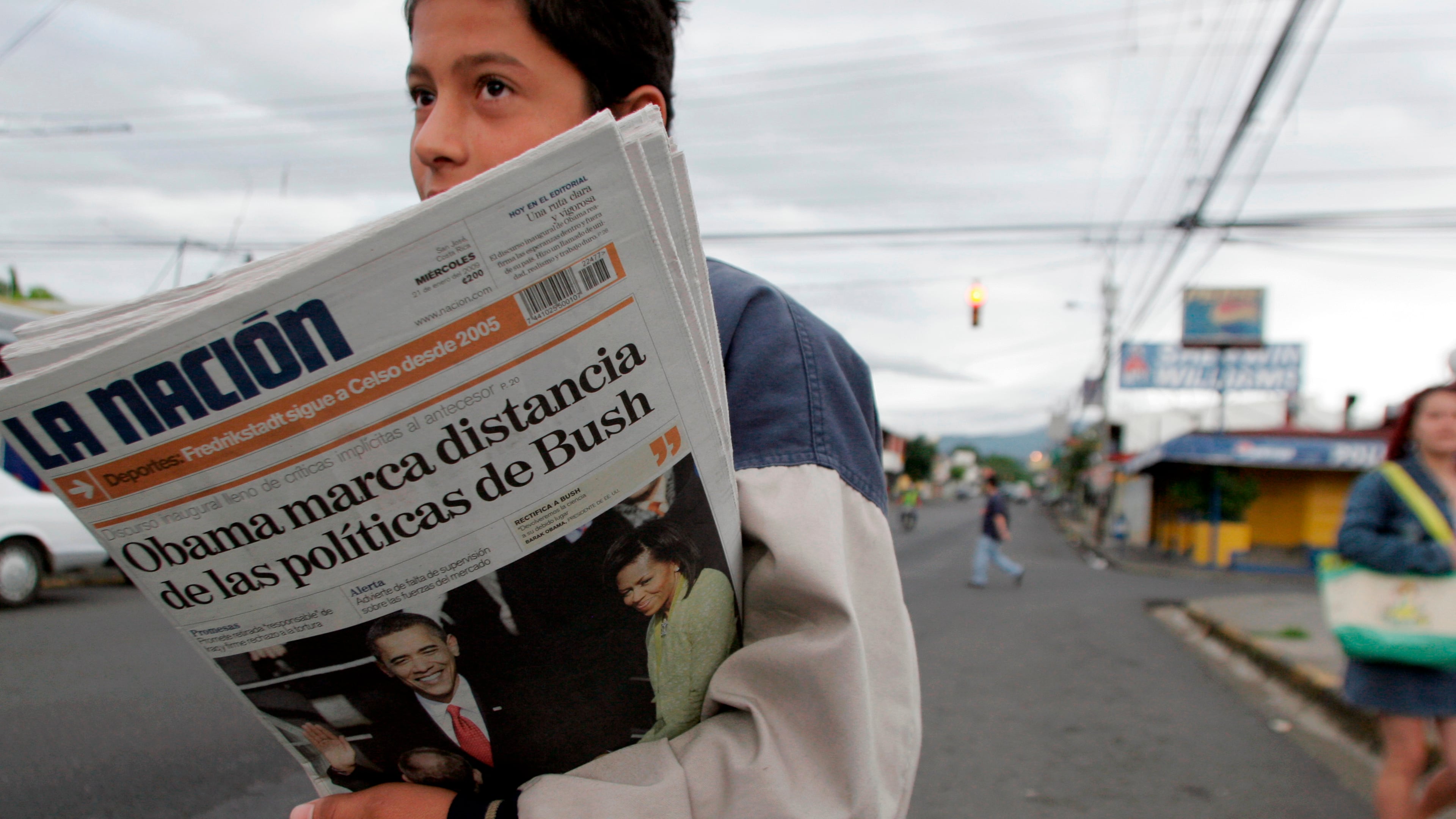 FILE - A vender sells La Nation newspapers in San Jose, Jan. 21, 2009. (AP Photo/Kent Gilbert, File)