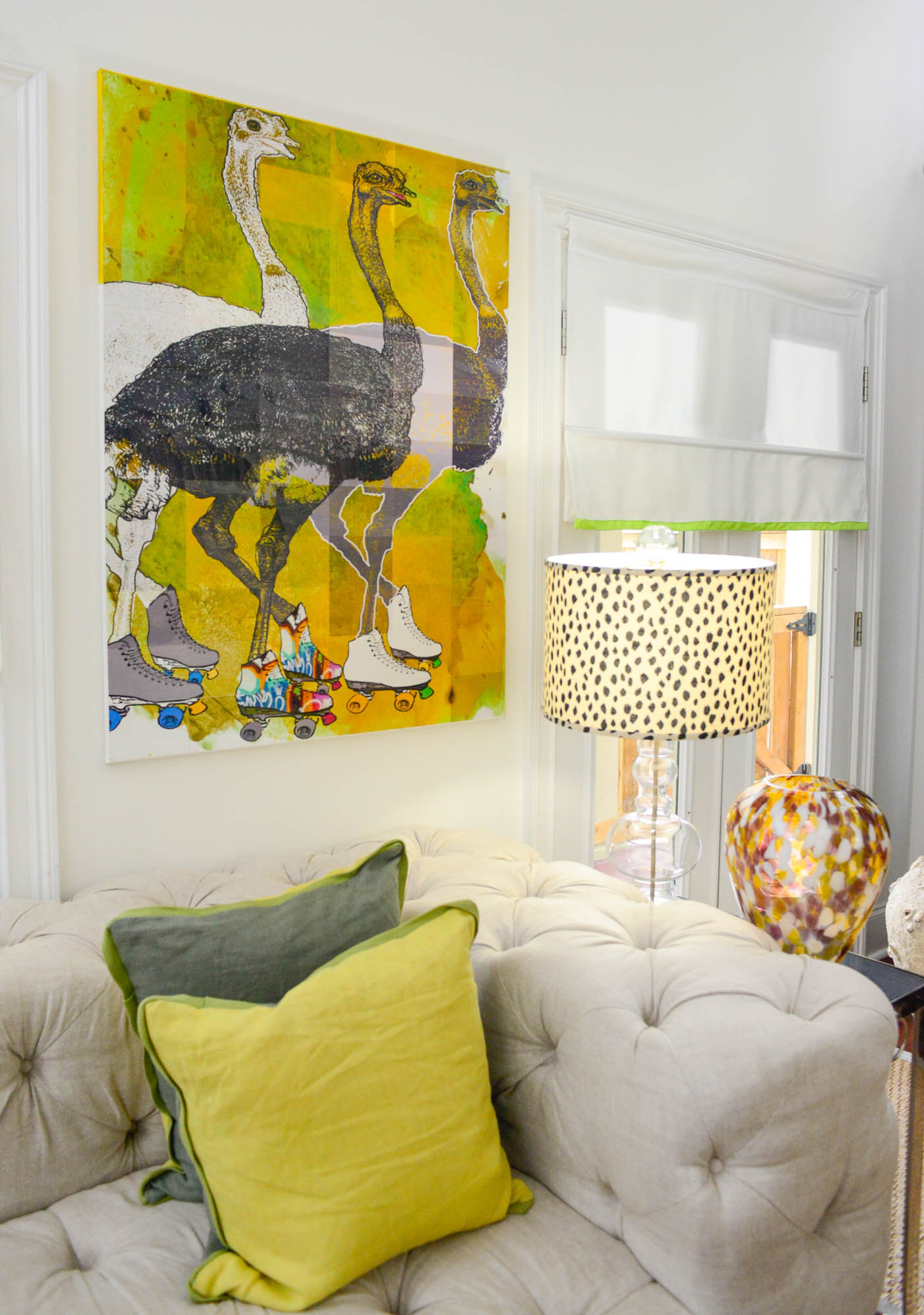 A fan of Chicago-based Matthew Lew's whimsical artwork, Resler reached out to the artist to commission an original for his Grant Park home. Resler received a signed painting of ostriches on roller skates, which now hangs in the living room above a tufted sectional sofa from RH.