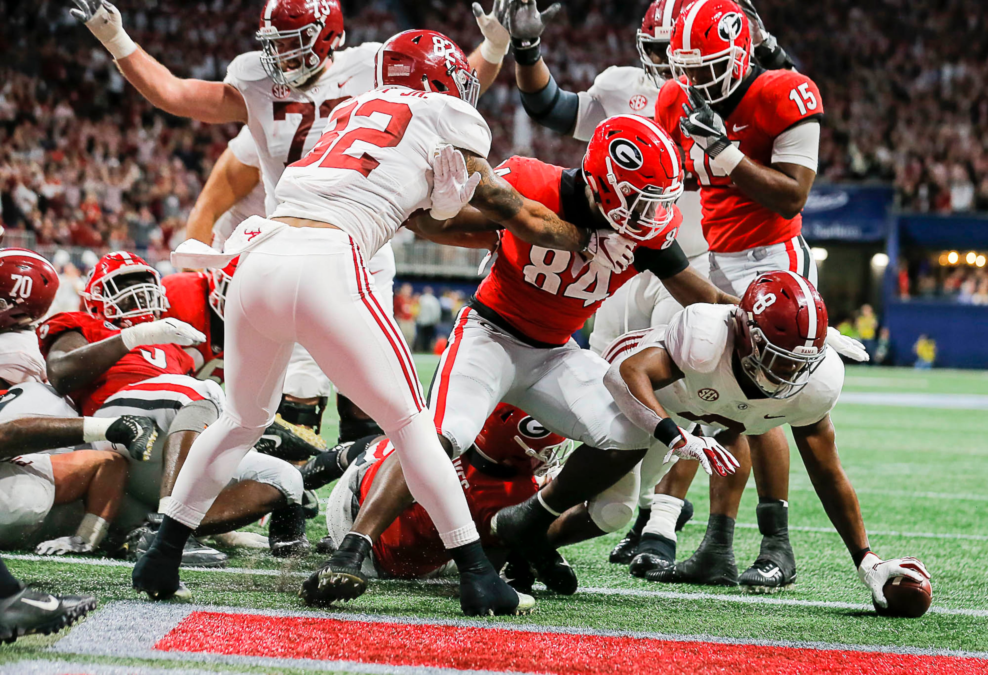 12/01/2018 -- Atlanta, Georgia -- Alabama Crimson Tide running back Josh Jacobs (8) scores a touchdown during the first half of the SEC Championship game at Mercedes-Benz Stadium in Atlanta, Saturday, December 1, 2018. (ALYSSA POINTER/ALYSSA.POINTER@AJC.COM)