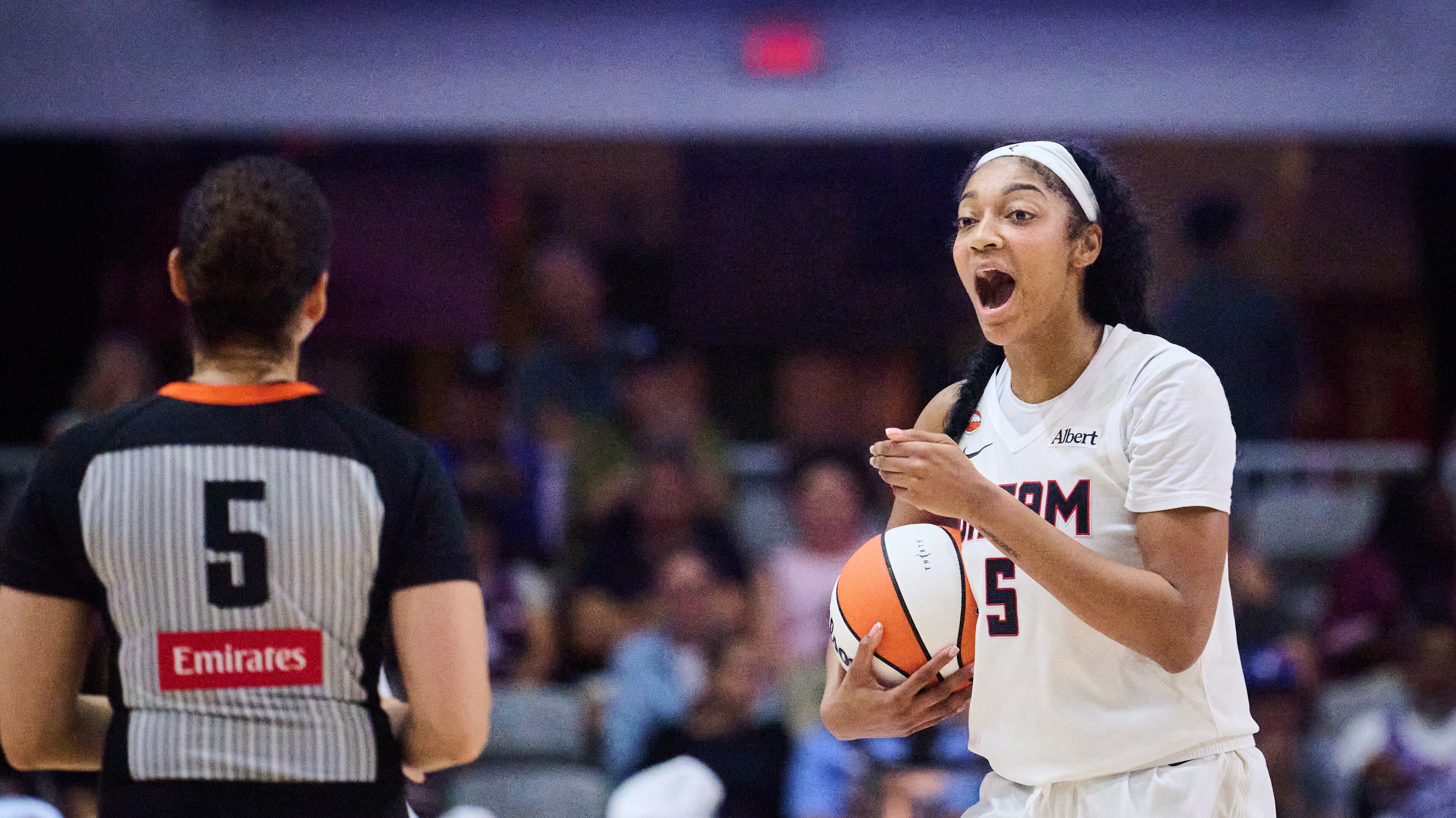 Dream All-Star Angel Reese, right, has 25 double-doubles this season, including Saturday's performance with 31 points and 14 rebounds. (Sammy Kogan/The Canadian Press via AP)