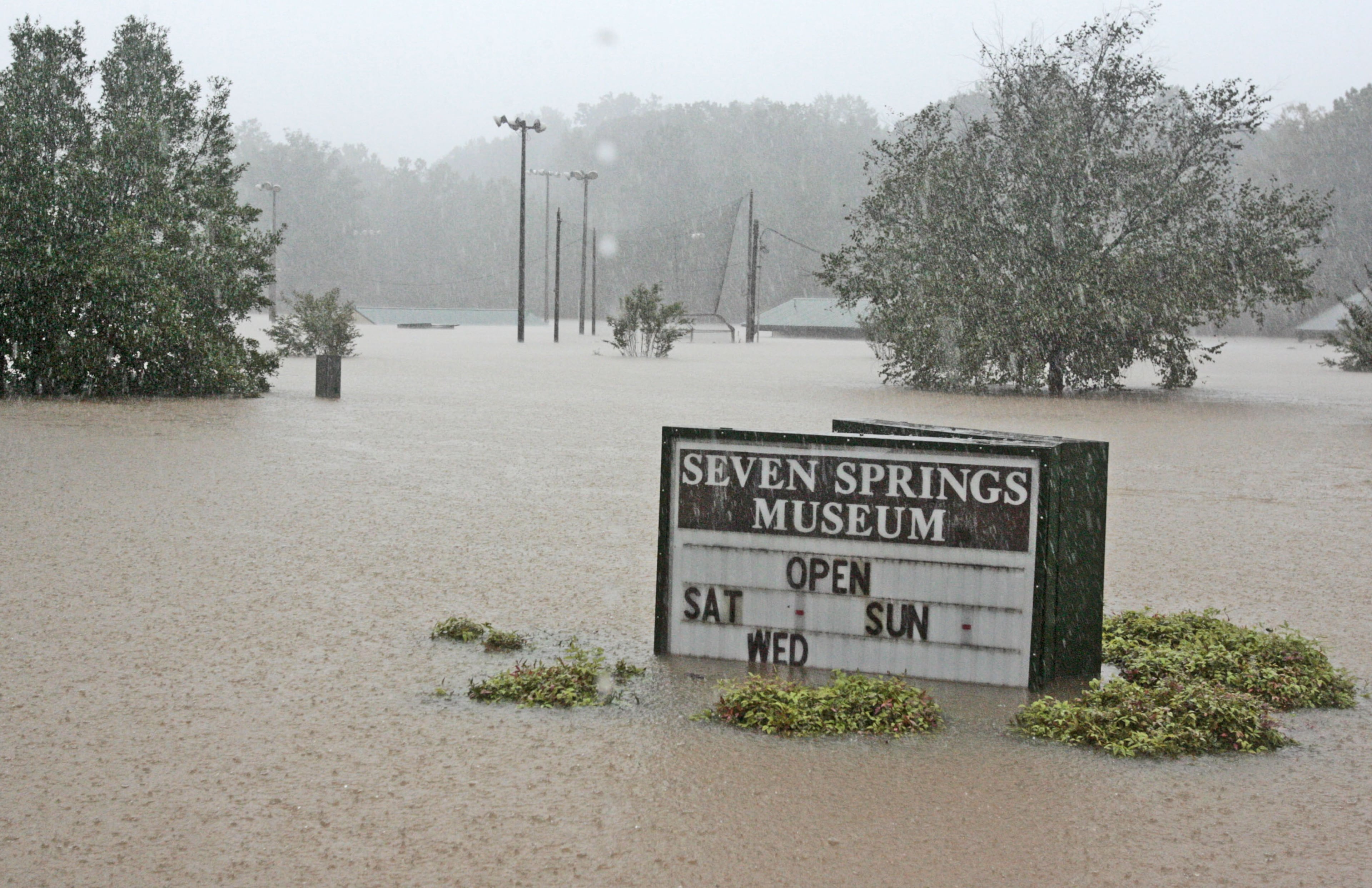090921- Powder Springs - The Seven Springs Museum on Marietta Rd. is under water. Flooding in downtown Powder Springs at Marietta Road and Brownsville Road.. Many roads were closed do to flooding. Mon, Sep. 21, 2009. Bob Andres, bandres@ajc.com