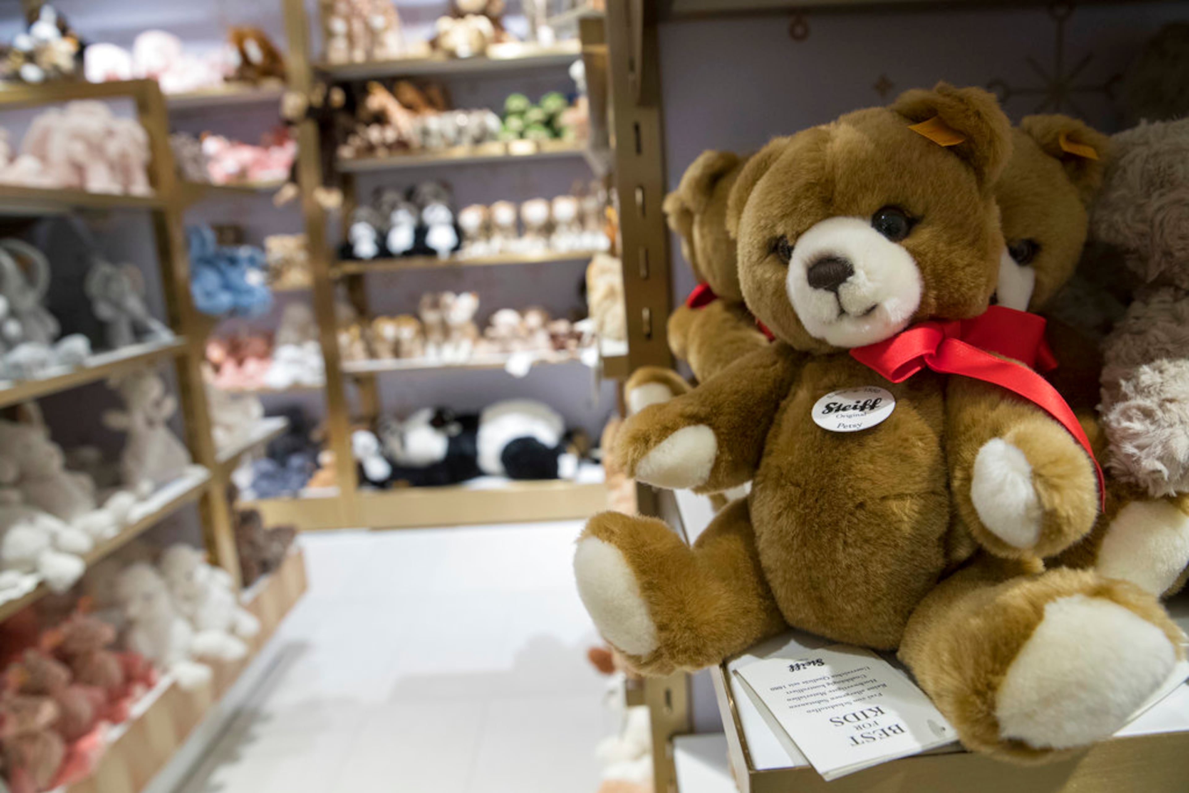 In this Tuesday, Nov. 13, 2018 photo, Steiff teddy bears are on display during a media preview of the new FAO Schwarz store at Rockefeller Center in New York. Three years after it closed its beloved, fantasy land of a toy store on Fifth Avenue, FAO Schwarz makes its return to New York City. The new version will be smaller, but will have familiar attractions including a musical clock tower and the giant piano keyboard mat on which Tom Hanks danced in the film âBig.â (AP Photo/Mary Altaffer)