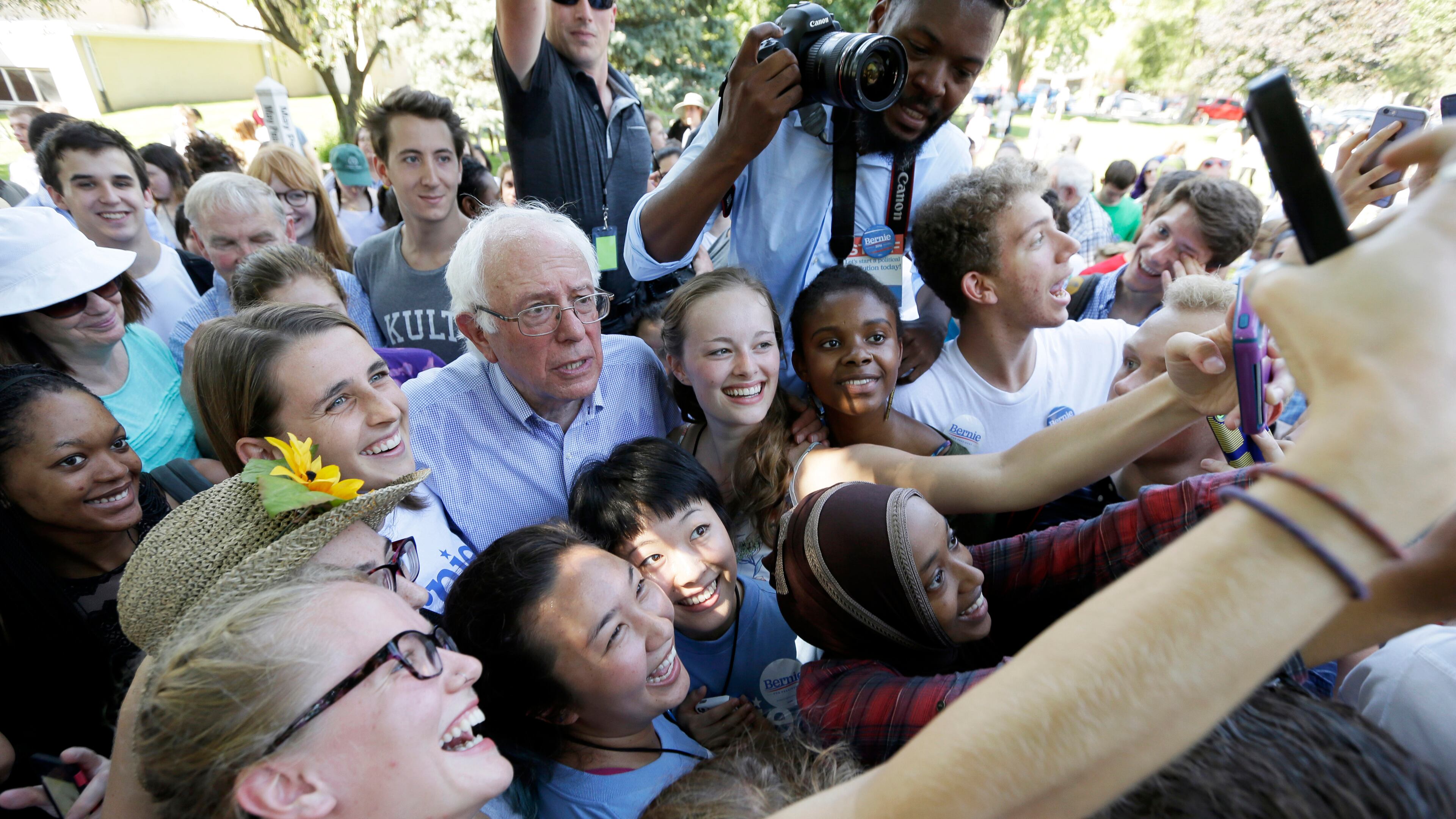 Democratic presidential candidate, Sen. Bernie Sanders, I-Vt., poses for a photo with supporters following a town hall meeting, Thursday, Sept. 3, 2015, in Grinnell, Iowa. (AP Photo/Charlie Neibergall)
