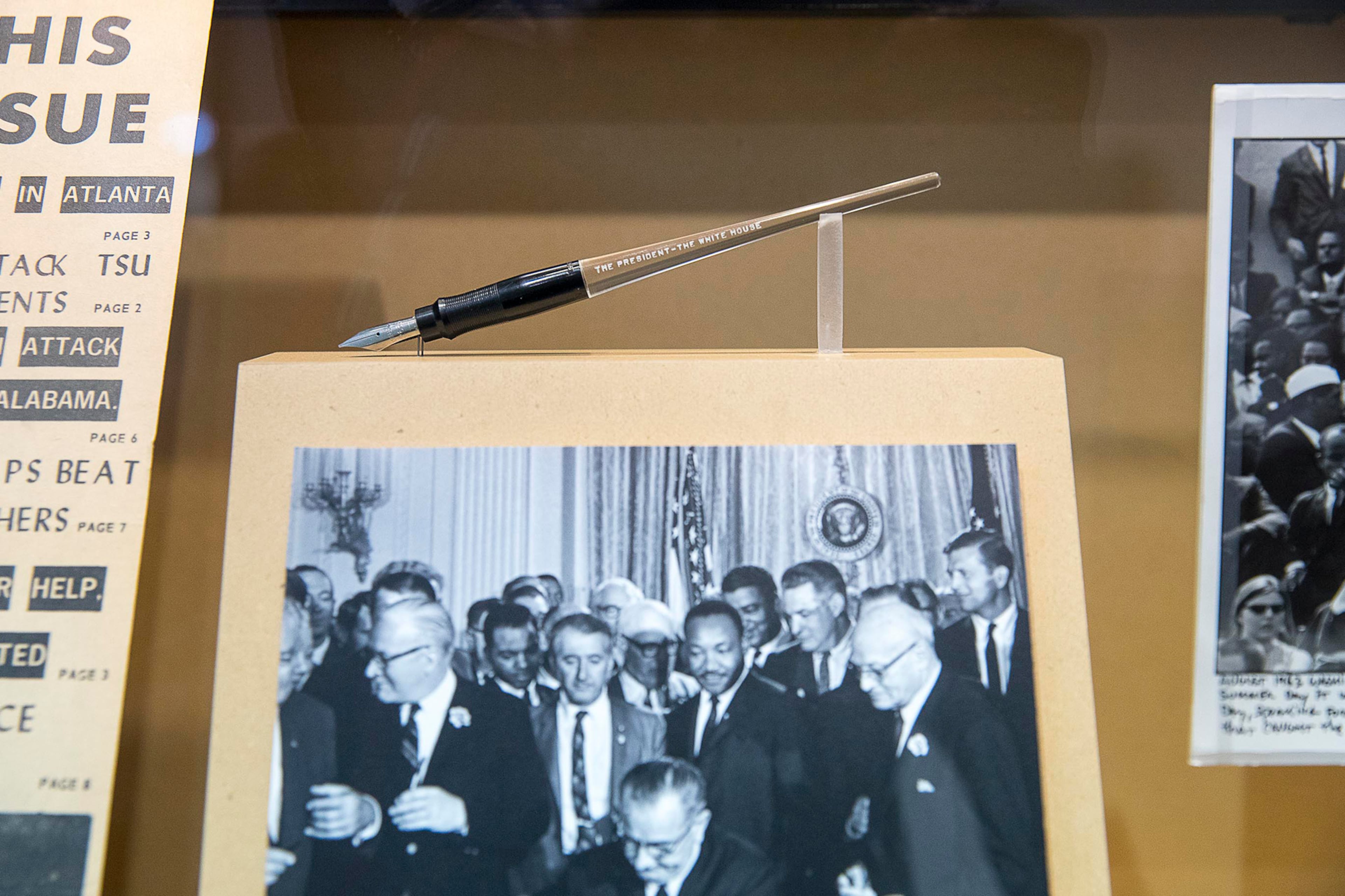 One of the pens that President Lyndon B. Johnson used to sign the Voting Rights Act is on display at a newly unveiled art exhibit and tribute to U.S. Congressman John Lewis, "John Lewis-Good Trouble." (ALYSSA POINTER/ALYSSA.POINTER@AJC.COM)