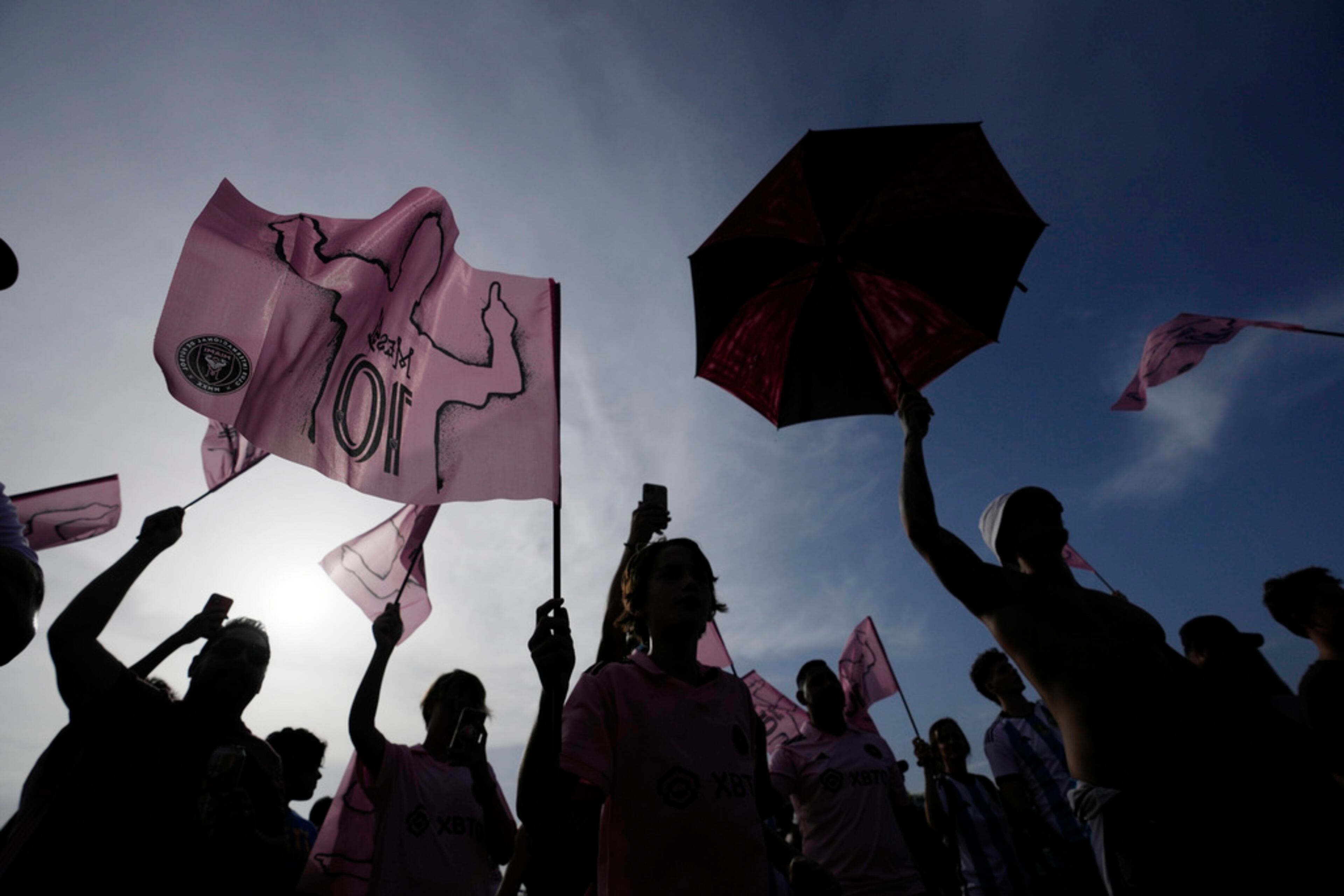 Fans gather outside the stadium before a Leagues Cup soccer match between Inter Miami and Atlanta United, Tuesday, July 25, 2023, in Fort Lauderdale, Fla. (AP Photo/Rebecca Blackwell)
