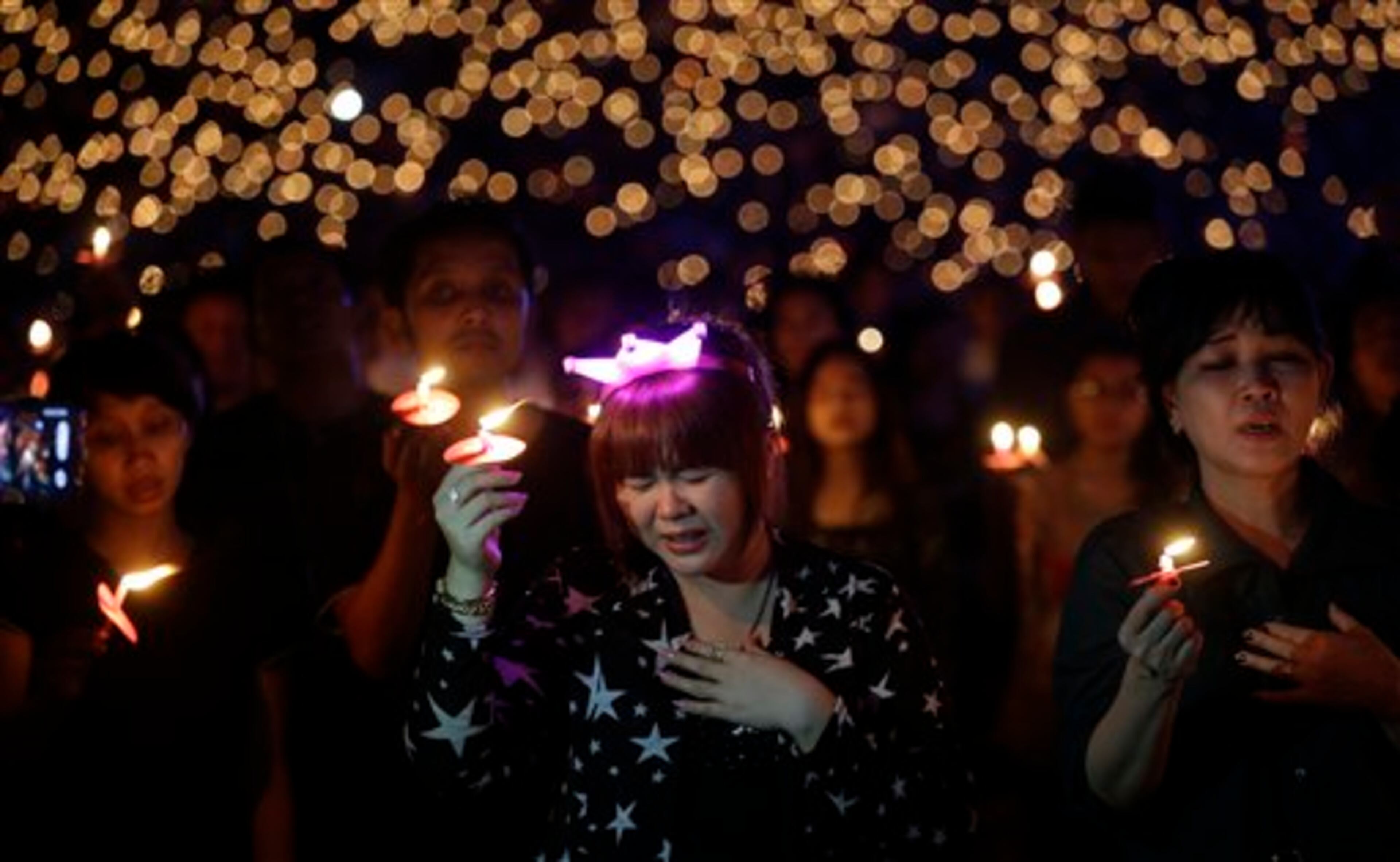Worshippers take part in a Christmas service at Gelora Bung Karno Stadium in Jakarta, Indonesia, Saturday, Dec 13, 2014. (AP Photo/Achmad Ibrahim)