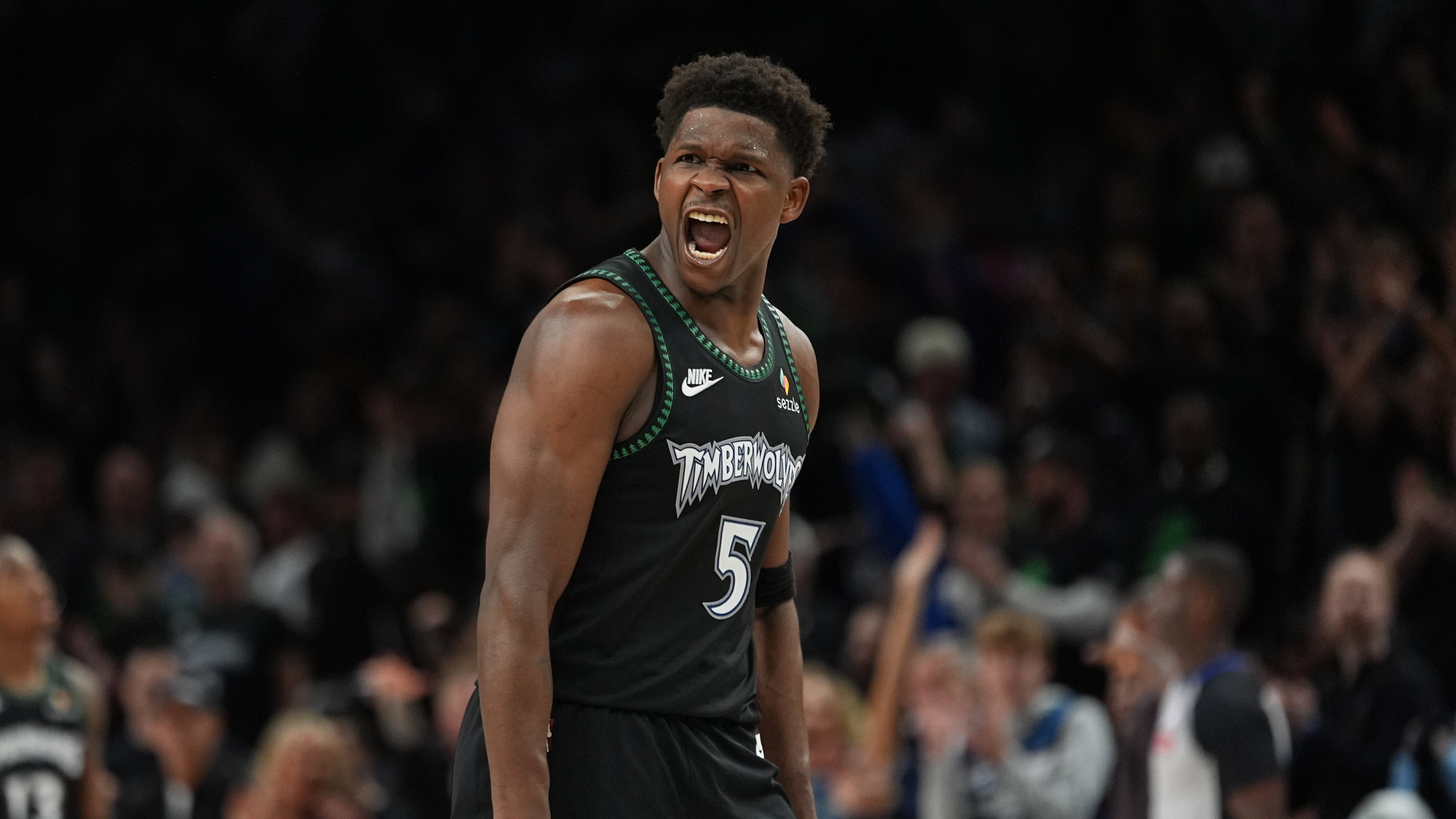 Minnesota Timberwolves guard Anthony Edwards (5) reacts after scoring against the San Antonio Spurs during the second half of Game 4 of an NBA basketball second-round playoffs series in Minneapolis, Sunday, May 10, 2026. (AP Photo/Abbie Parr)