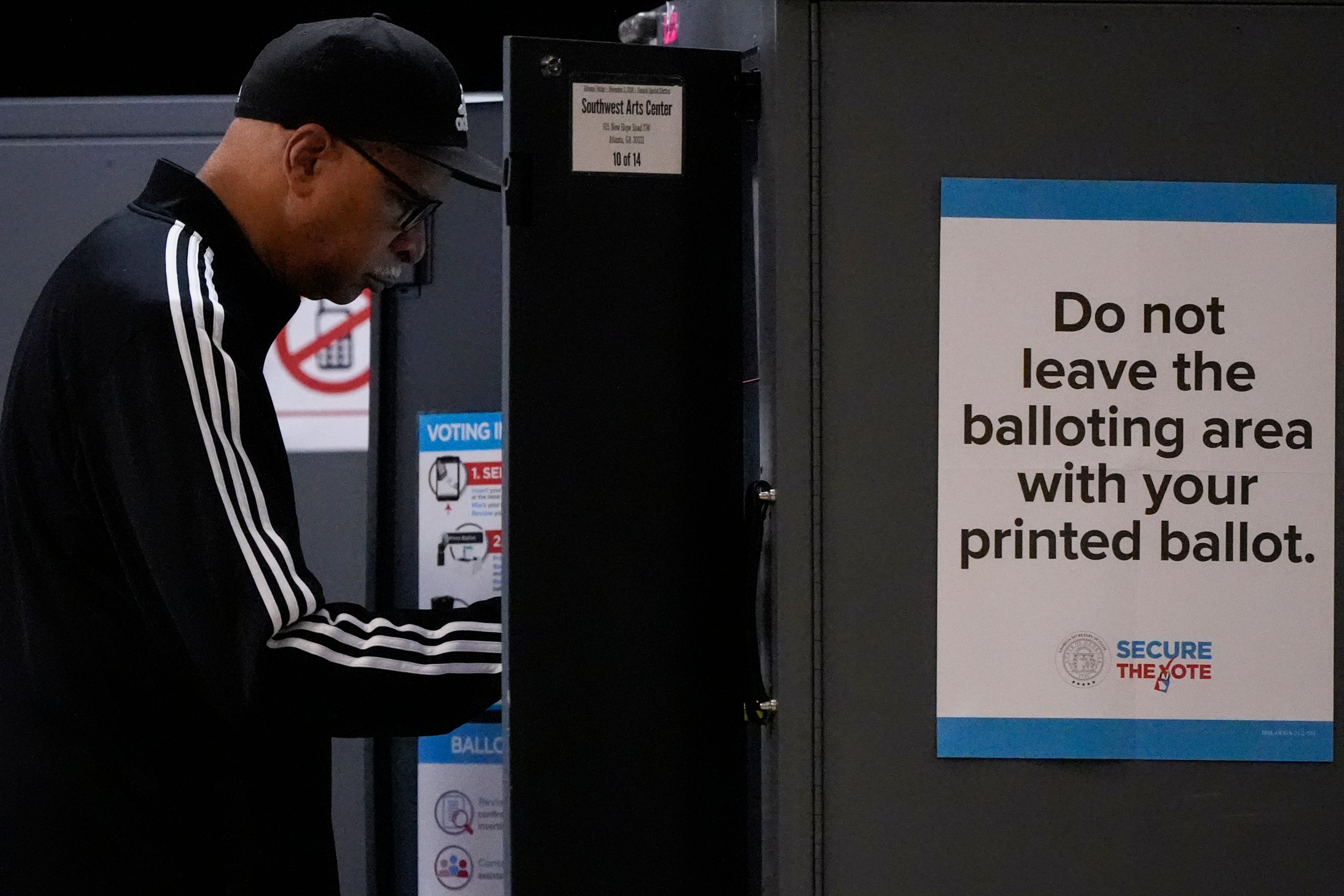 A man votes at the Southwest Arts Center voting site on the first day for early voting in Georgia. (Mike Stewart/AP)