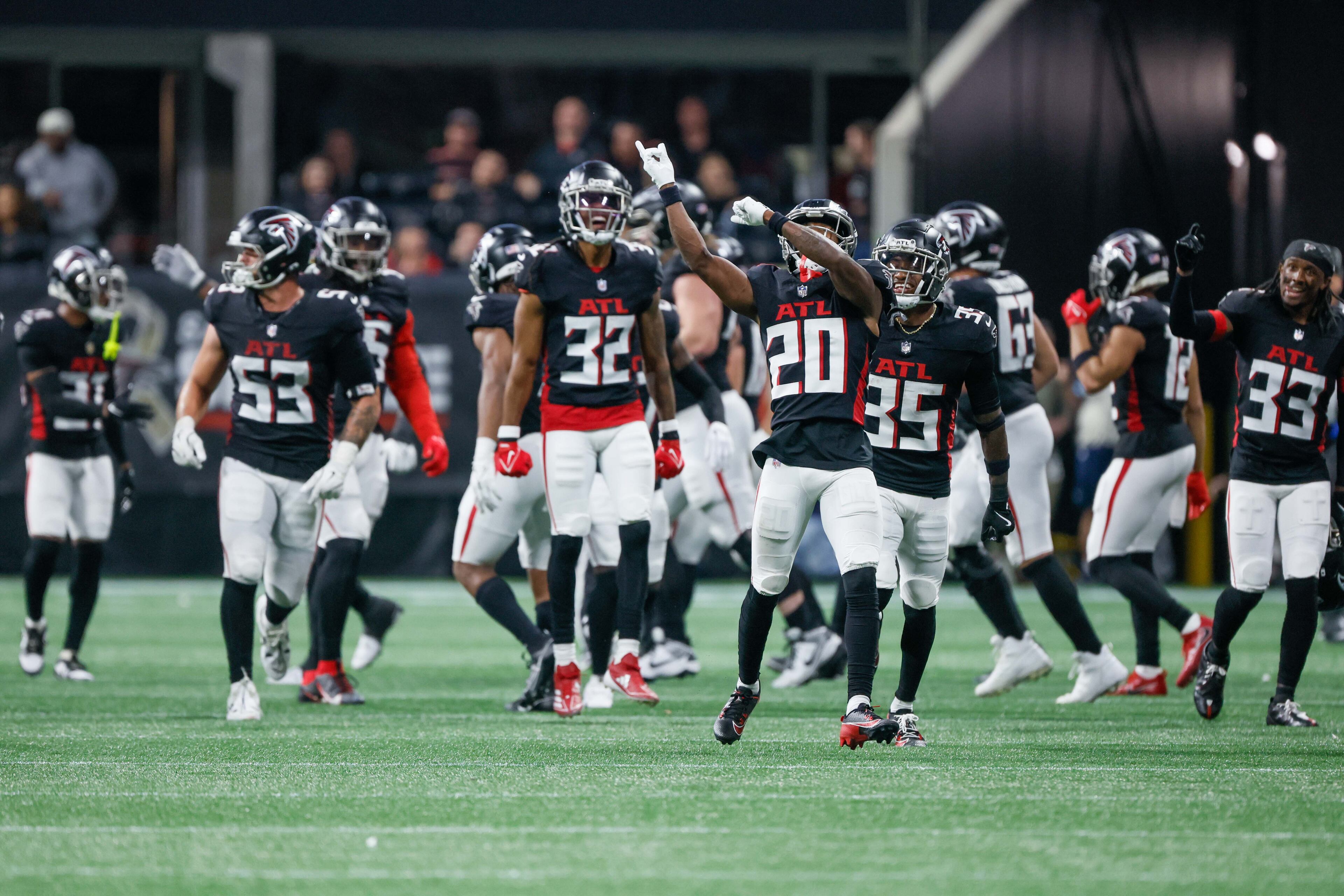 Falcons players celebrate after stopping a fourth down against the Dallas Cowboys during the second half of an NFL football game on Sunday, Nov. 3, 2024, at Mercedes-Benz Stadium in Atlanta.
(Miguel Martinez/ AJC)
