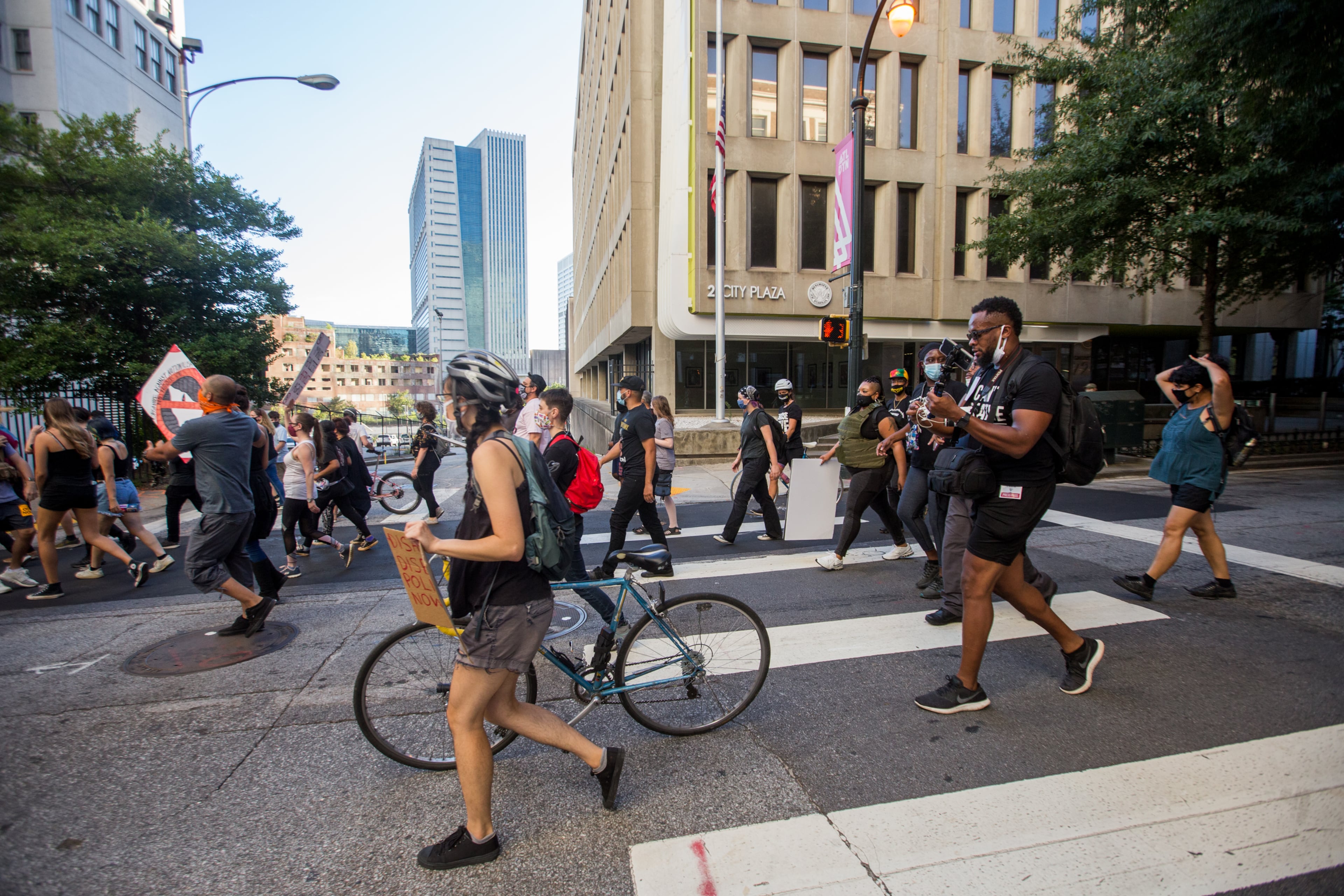 Protesters march down Marietta Street on Saturday, September 5, 2020. The protest started at Ebenezer Baptist Church as a political gathering and joined at CNN Center with a Black Lives Matter protest, in memory of Dijon Kizzee, the Black man who was fatally shot by Los Angeles County Sheriff's deputies earlier in the week. (Jenni Girtman for The Atlanta Journal-Constitution)