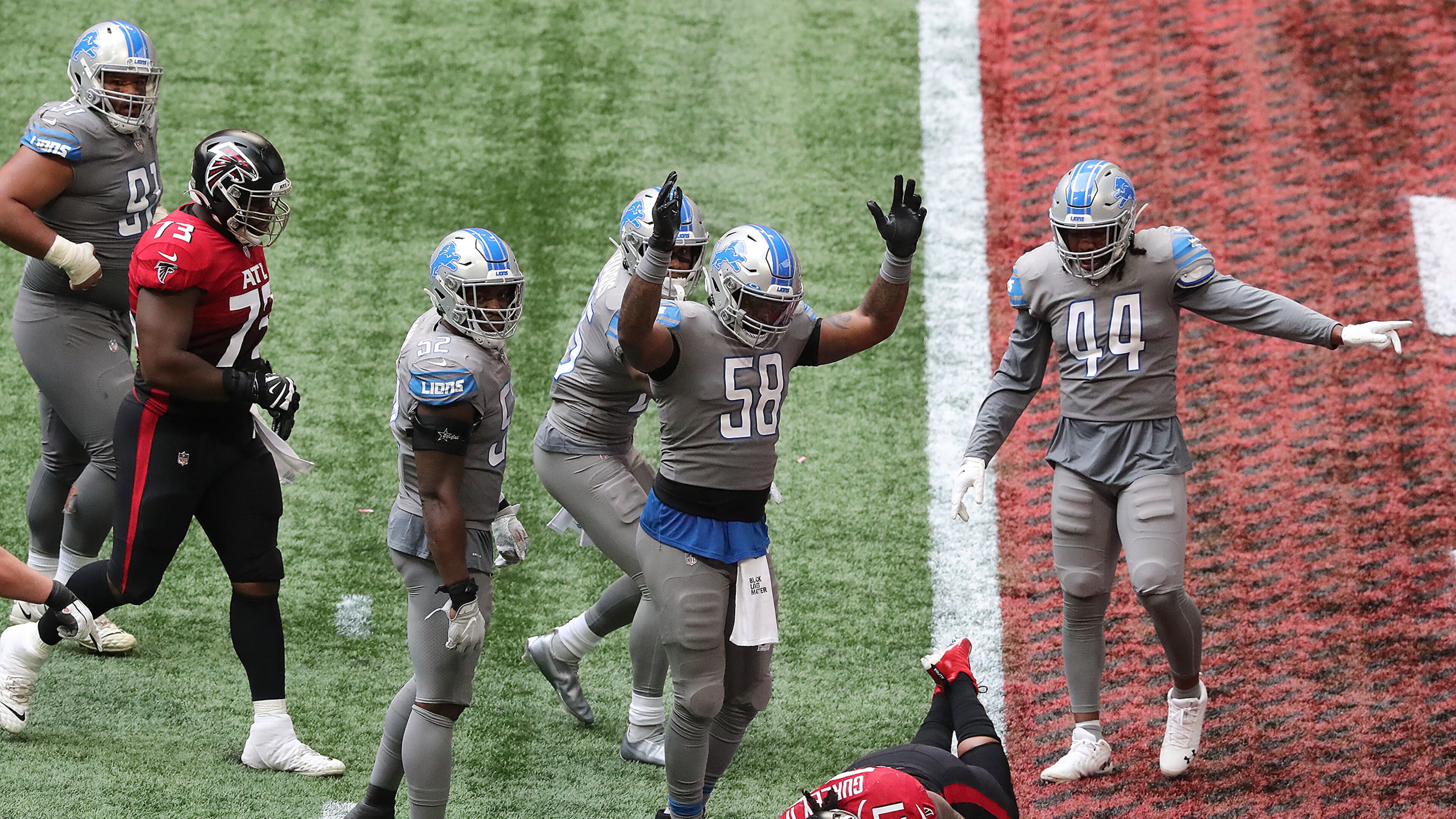 102520 Atlanta: Detroit Lions linebacker Jamie Collins signals touchdown as Falcons running back Todd Gurley trys to stop short of the endzone to control the final minutes of the clock in the fourth quarter of an NFL football game on Sunday, Oct 25, 2020 in Atlanta. Gurley broke the plane for a touchdown for a 20-16 lead and the Falcons added the 2-point conversion to extend the lead to 22-16 but left enough time on the clock for the Lions to come back for the game winning touchdown and extra point to beat the Falcons 23-22 as time expired. “Curtis Compton / Curtis.Compton@ajc.com”