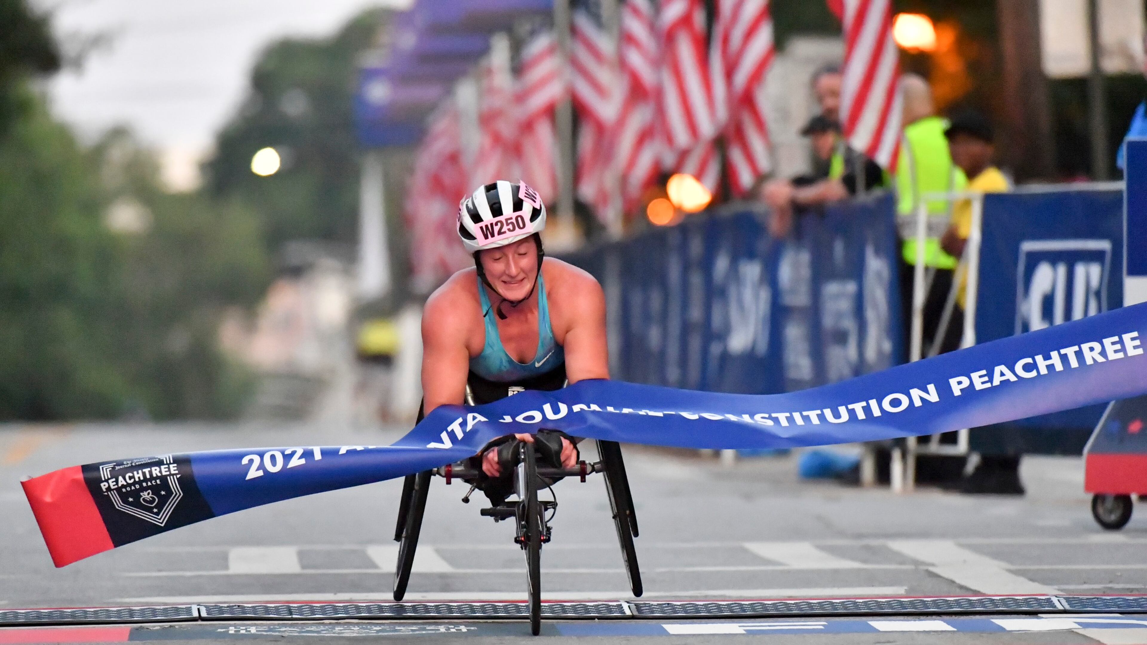 Tatyana McFadden won her eighth Atlanta Journal-Constitution Shepard Center women’s wheelchair title Sunday morning as the AJC Peachtree Road Race returned in-person for the second day Sunday for the holiday tradition. Hyosub Shin / Hyosub.shin@ajc.com