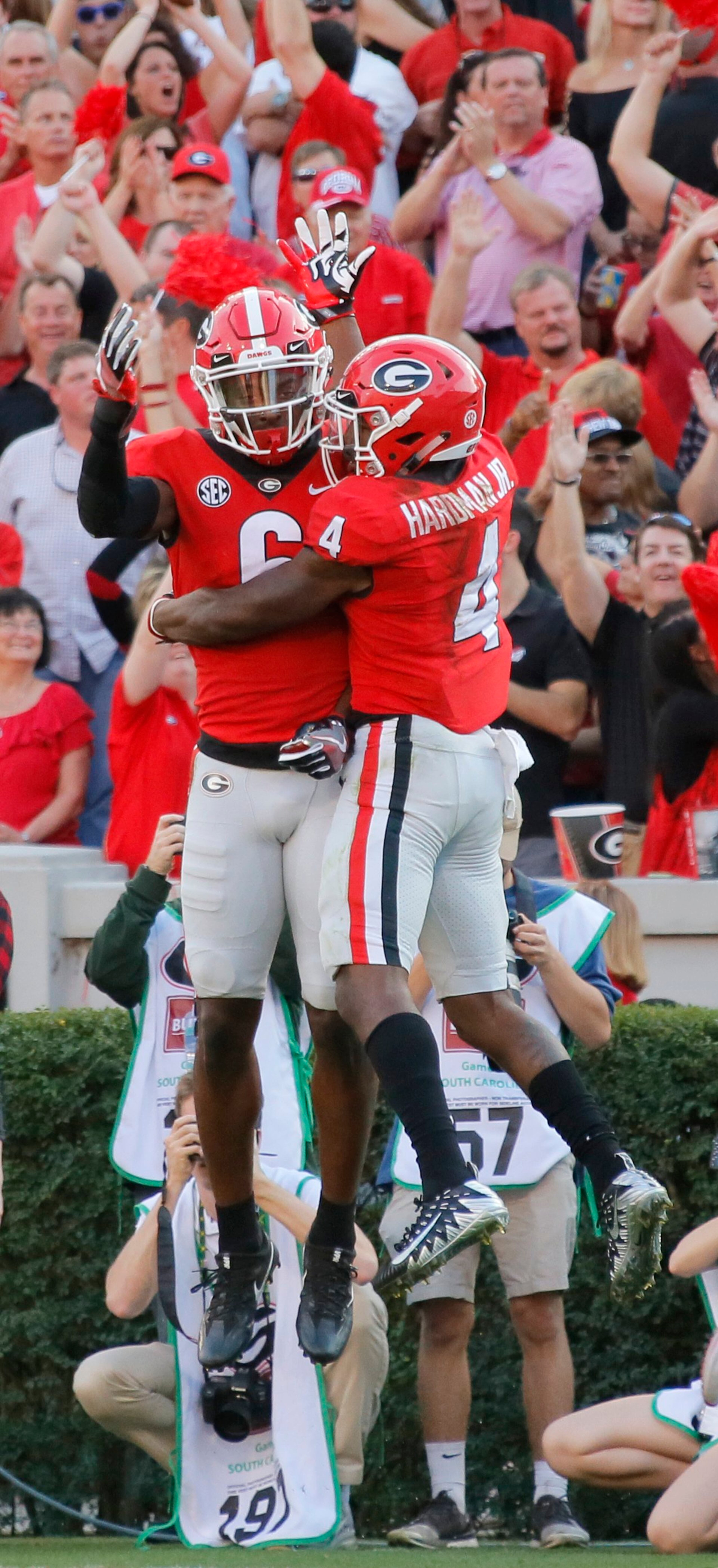 11/4/17 - Athens - Georgia Bulldogs wide receiver Mecole Hardman (4) celebrates with Georgia Bulldogs wide receiver Javon Wims (6) after he scored in the second half over defender South Carolina Gamecocks defensive back Jamyest Williams (21). NCAA football game between the University of Georgia Bulldogs and the University of South Carolina Gamecocks BOB ANDRES /BANDRES@AJC.COM