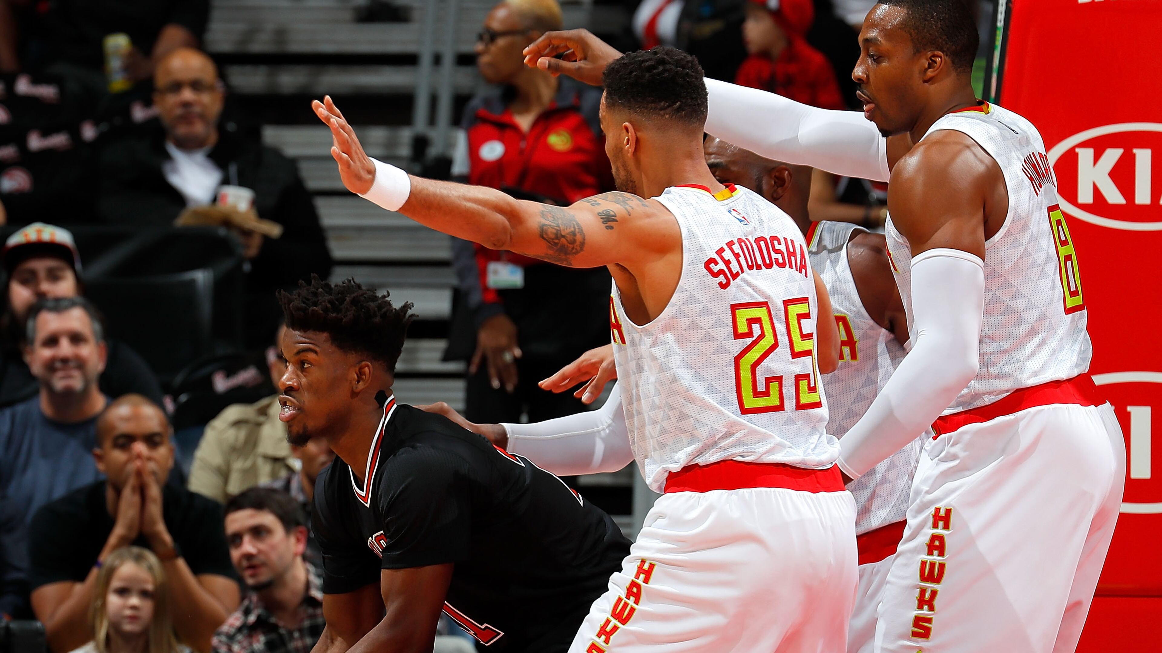 Thabo Sefolosha (25), Dwight Howard (8) and Paul Millsap (4) of the Atlanta Hawks defend against Jimmy Butler (21) of the Chicago Bulls at Philips Arena on January 20, 2017 in Atlanta, Georgia. (Photo by Kevin C. Cox/Getty Images)
