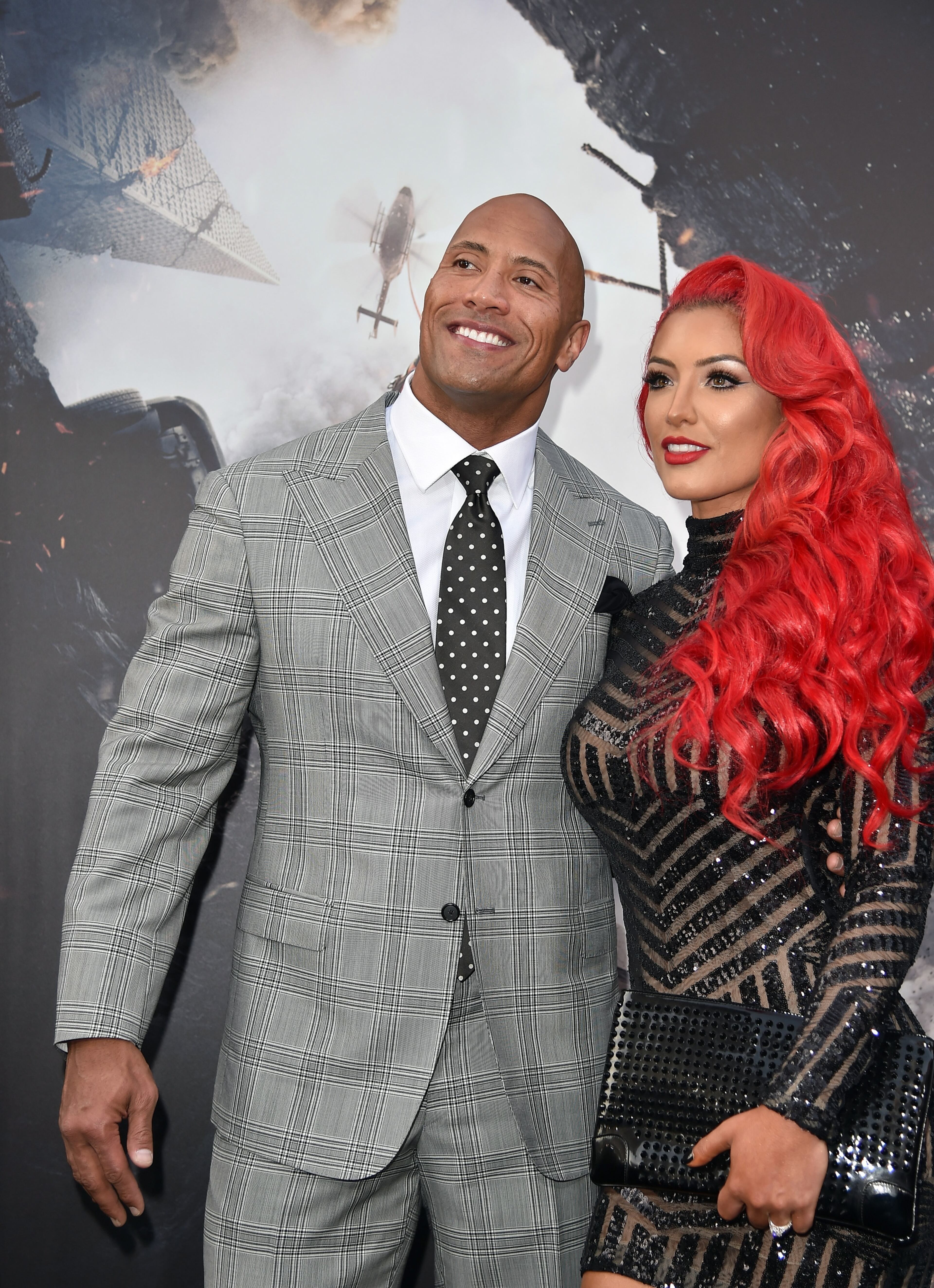 HOLLYWOOD, CA - MAY 26: Actor Dwayne "The Rock" Johnson (L) and Model/TV personality Eva Marie arrive at the premiere of Warner Bros. Pictures' "San Andreas" at TCL Chinese Theatre on May 26, 2015 in Hollywood, California. (Photo by Kevin Winter/Getty Images)