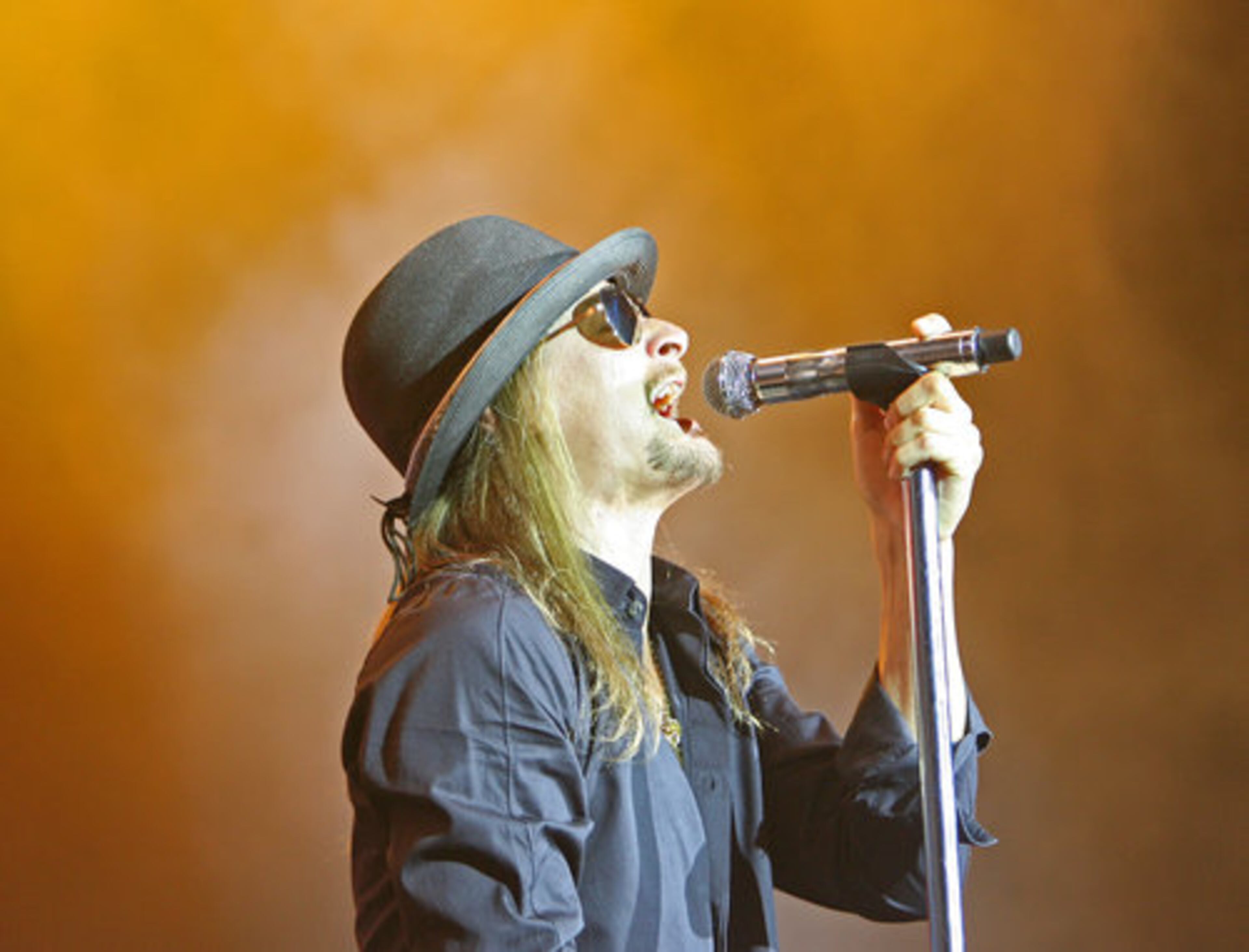 ROCK, ROCKIN': Singer Kid Rock performs Tuesday at the Cynthia Woods Mitchell Pavilion in The Woodlands, Texas.