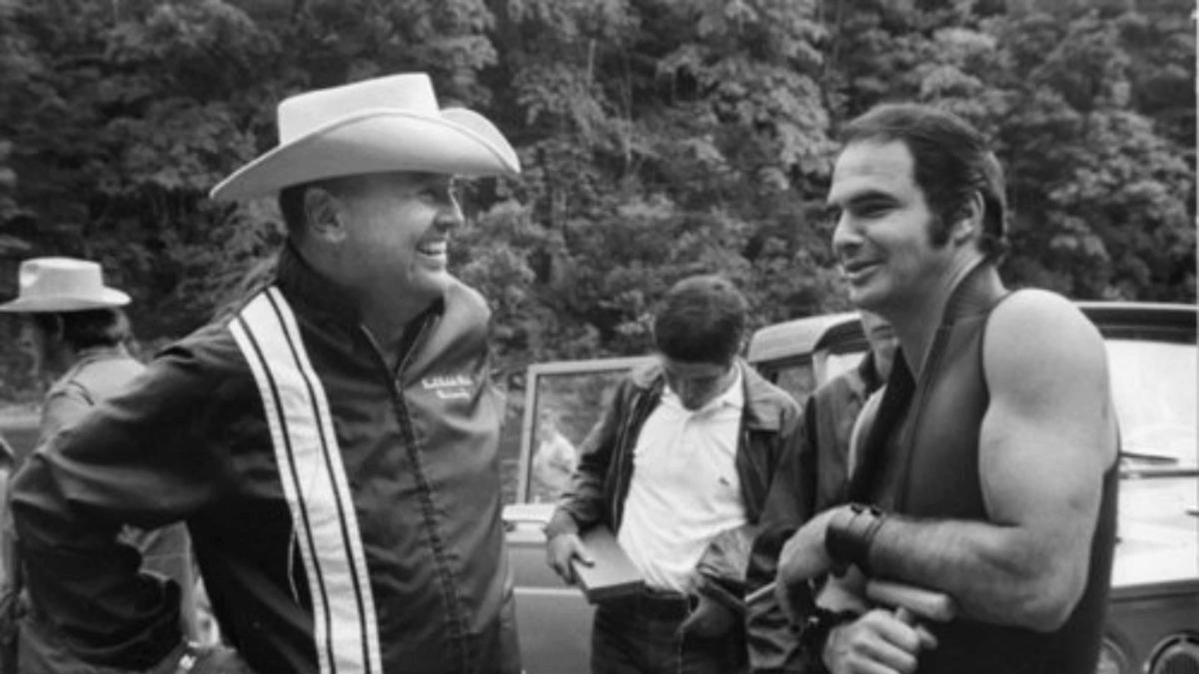 James Dickey (left) wrote "Deliverance" the novel, and movie starring a young Burt Reynolds (right).