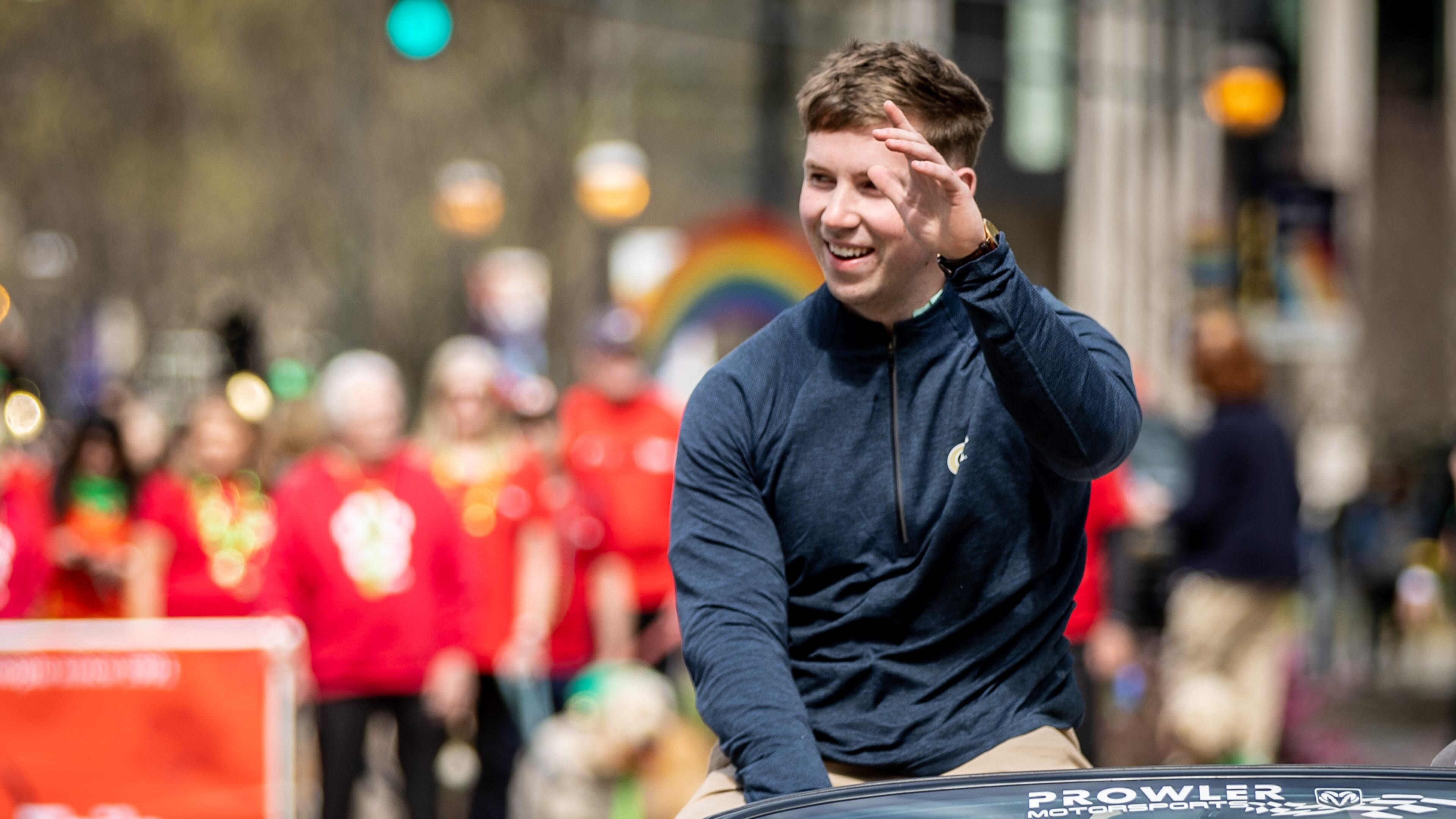 Grand marshal and Georgia Tech football player David Shanahan waves to the crowd during Atlanta's St. Patrick's Parade on Saturday, March 11, 2023. Shanahan is from Castleisland, County Kerry, Ireland. (Photo: Steve Schaefer / steve.schaefer@ajc.com)