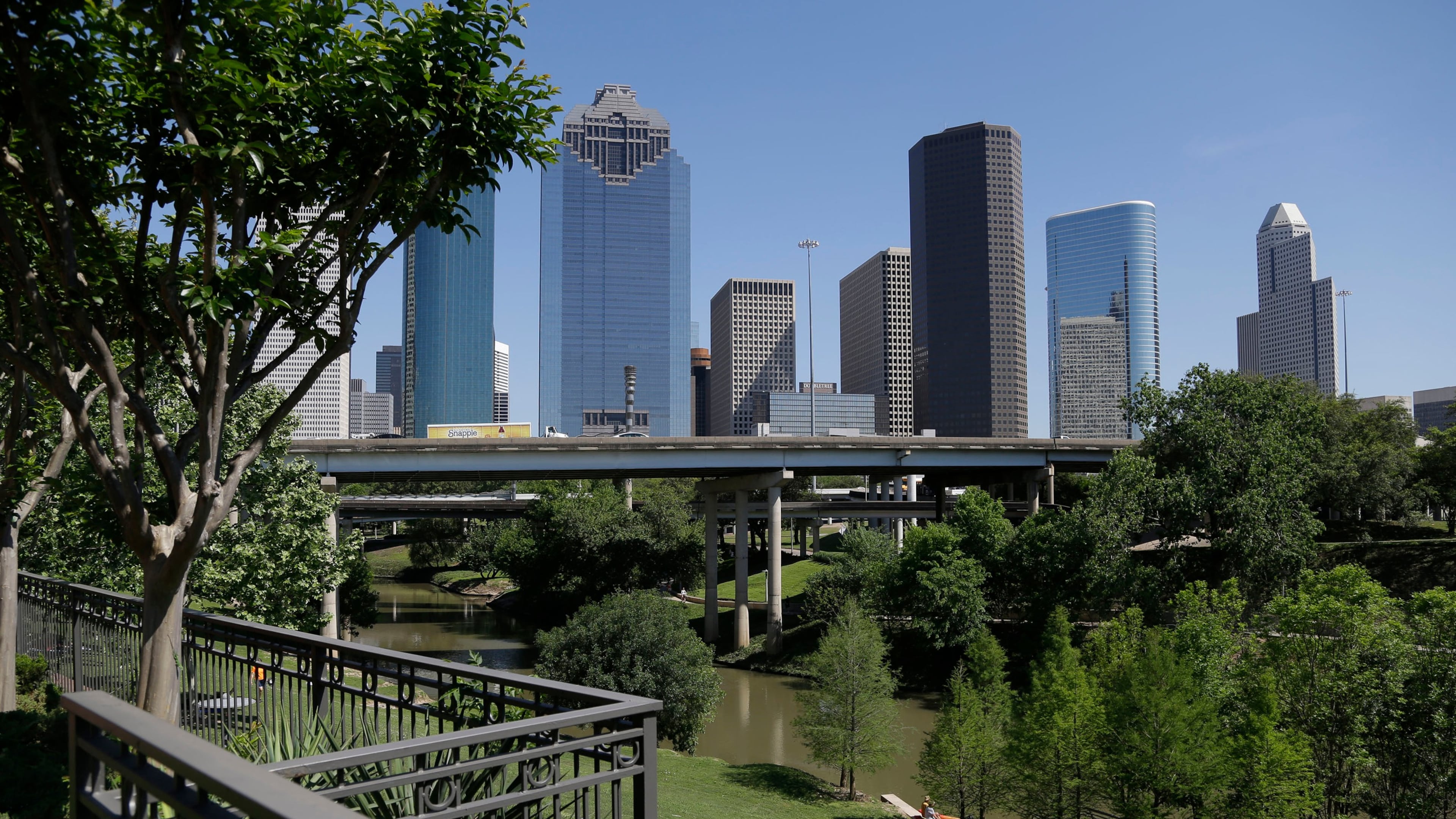 FILE - The Houston skyline overlooks the Buffalo Bayou as it snakes its' way into downtown April 18, 2014. (AP Photo/Pat Sullivan, File)