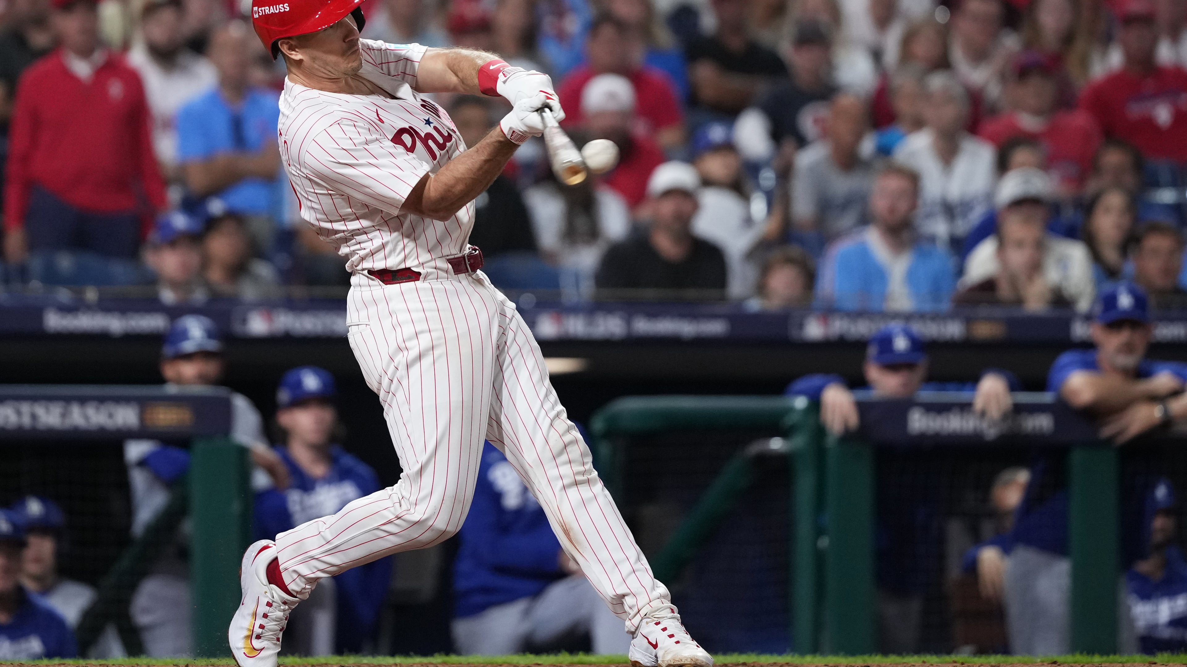 FILE - Philadelphia Phillies' J.T. Realmuto hits a double during the ninth inning in Game 2 of baseball's National League Division Series against the Los Angeles Dodgers, Monday, Oct. 6, 2025, in Philadelphia. (AP Photo/Matt Slocum, File)