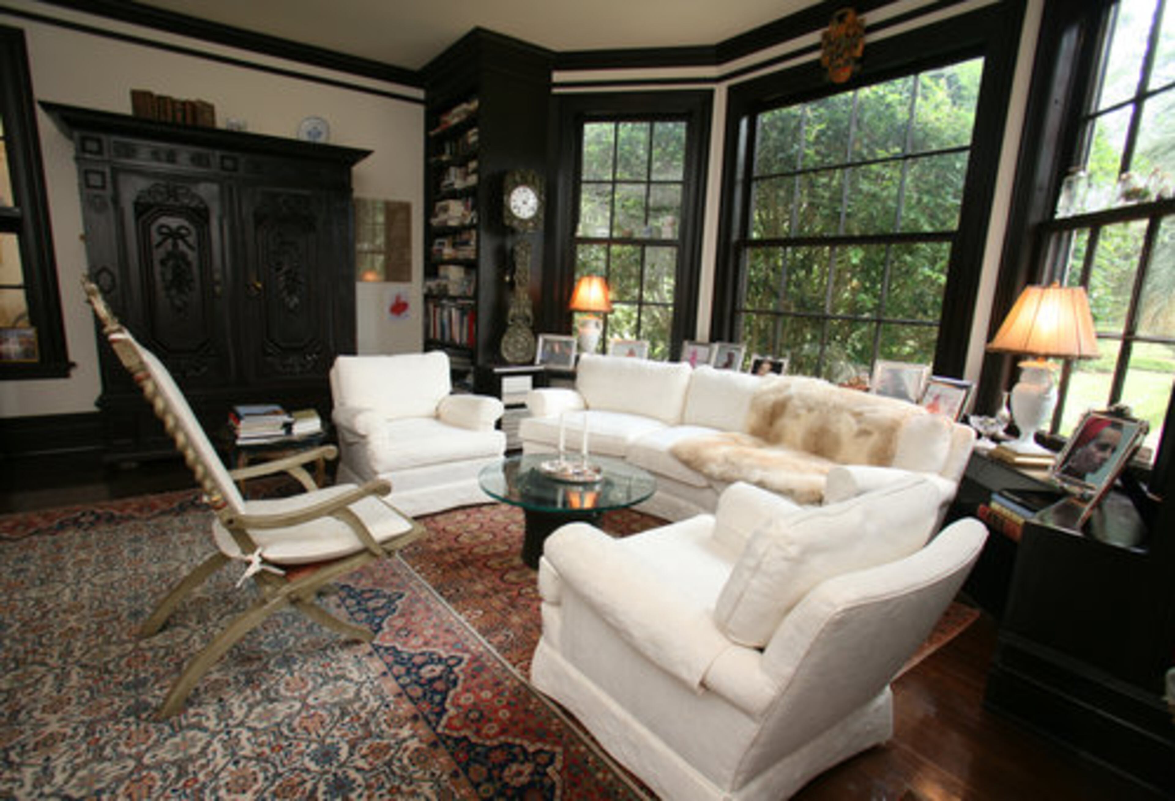 A smaller library across the hall includes an antique armoire from Alexandra's family. The interior lock is etched with a hunting scene. "I think it is a very well-proportioned room," Kauka said. The alcove looks out on the gardens in front of the house.