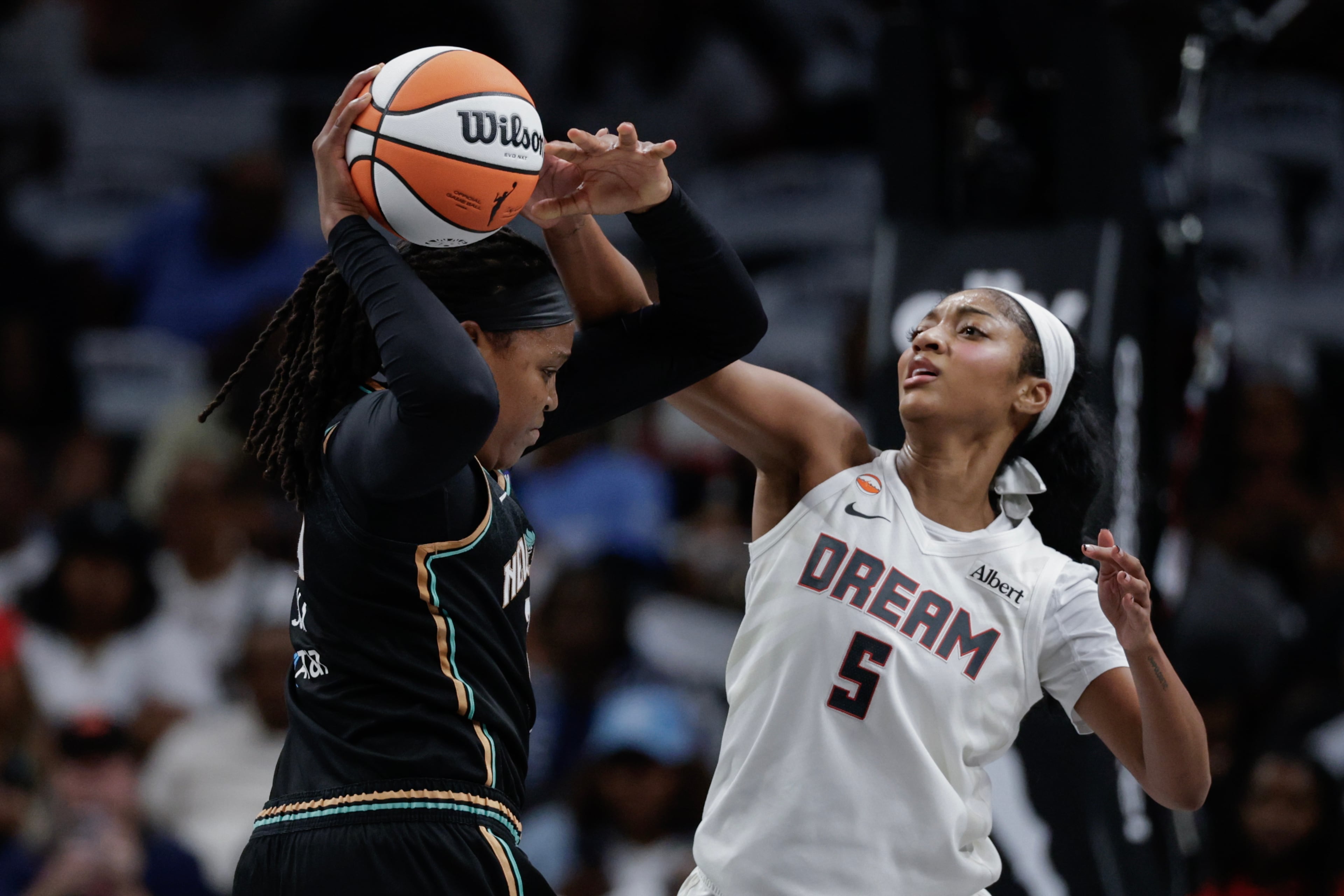 Atlanta Dream forward Angel Reese (5) defends against New York Liberty center Jonquel Jones (35) during the first half of a WNBA semifinal playoff game 1 between the Atlanta Dream and the New York Liberty, Sunday, Oct. 4, 2026, in Atlanta. (Erik S. Lesser for the AJC)