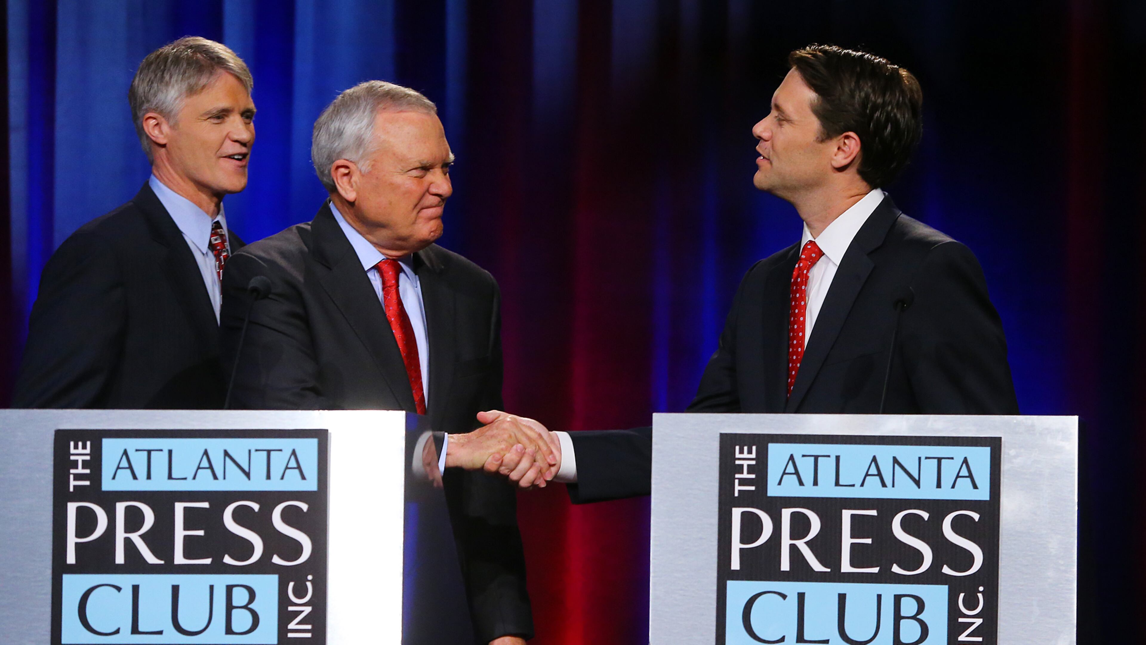 Libertarian candidate Andrew Hunt (from left), Governor Nathan Deal and Democrat Jason Carter conclude their second debate during The Atlanta Press Club Loudermilk-Young Debate Series at Georgia Public Broadcasting on Sunday, Oct. 19, 2014, in Atlanta. CURTIS COMPTON / CCOMPTON@AJC.COM