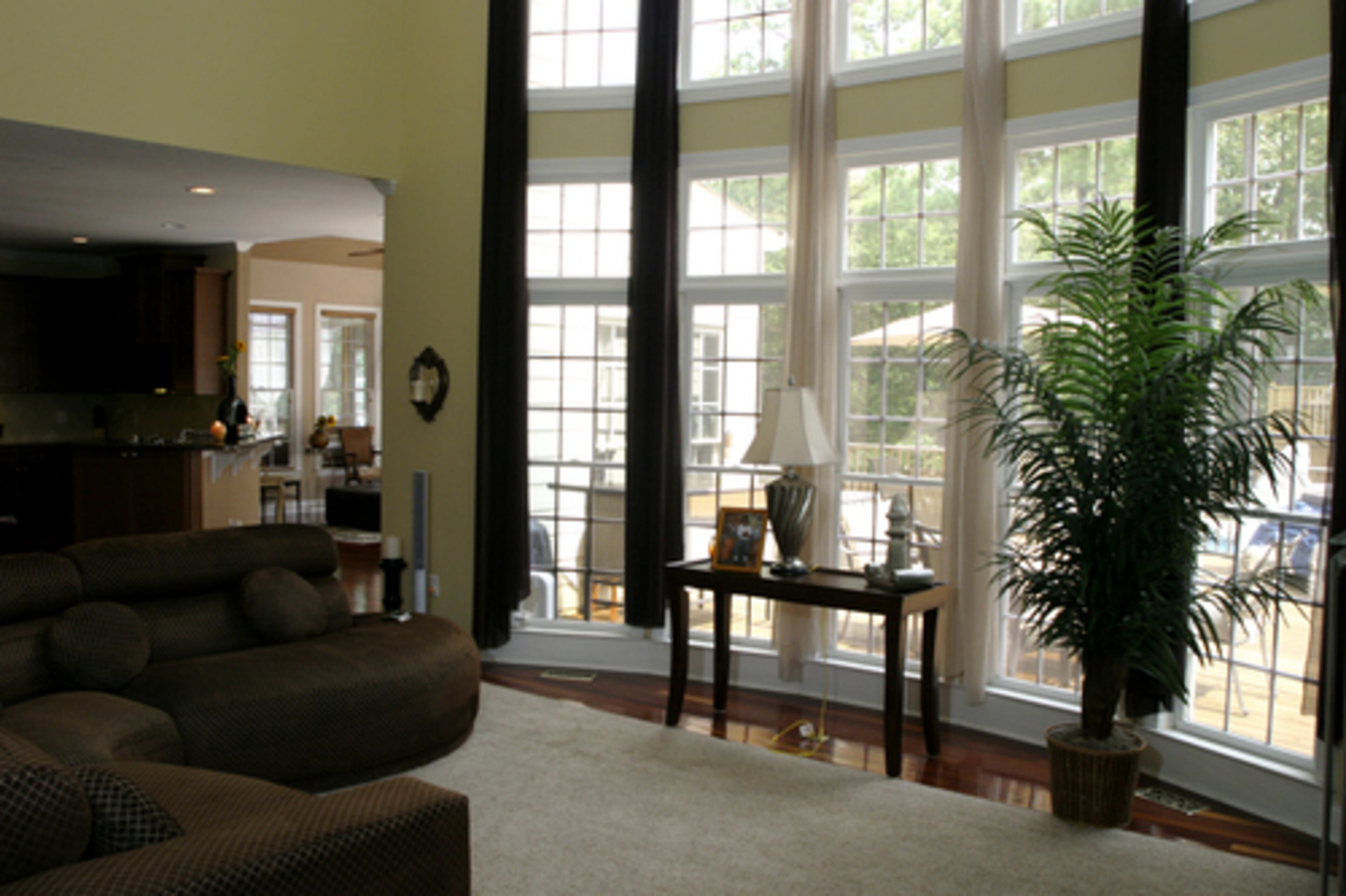 The family room is where the Parkers like to kick back and watch television. They bought the sectional and had it recovered in the mocha brown material. Sharlinda Parker favors reupholstering, especially with kids.