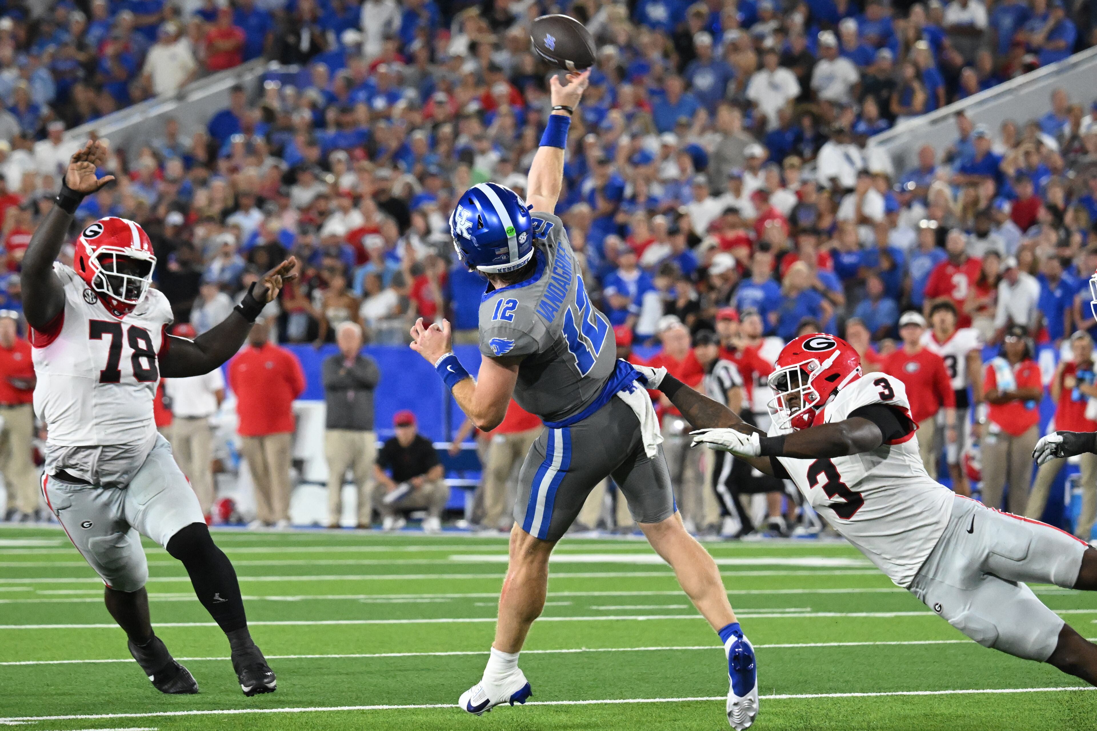 Kentucky quarterback Brock Vandagriff (12) gets off a pass under pressure from Georgia linebacker CJ Allen (3) during the second half in an NCAA football game at Kroger Field, Saturday, September 14, 2024, in Lexington, Kentucky. Georgia won 13-12 over Kentucky. (Hyosub Shin / AJC)