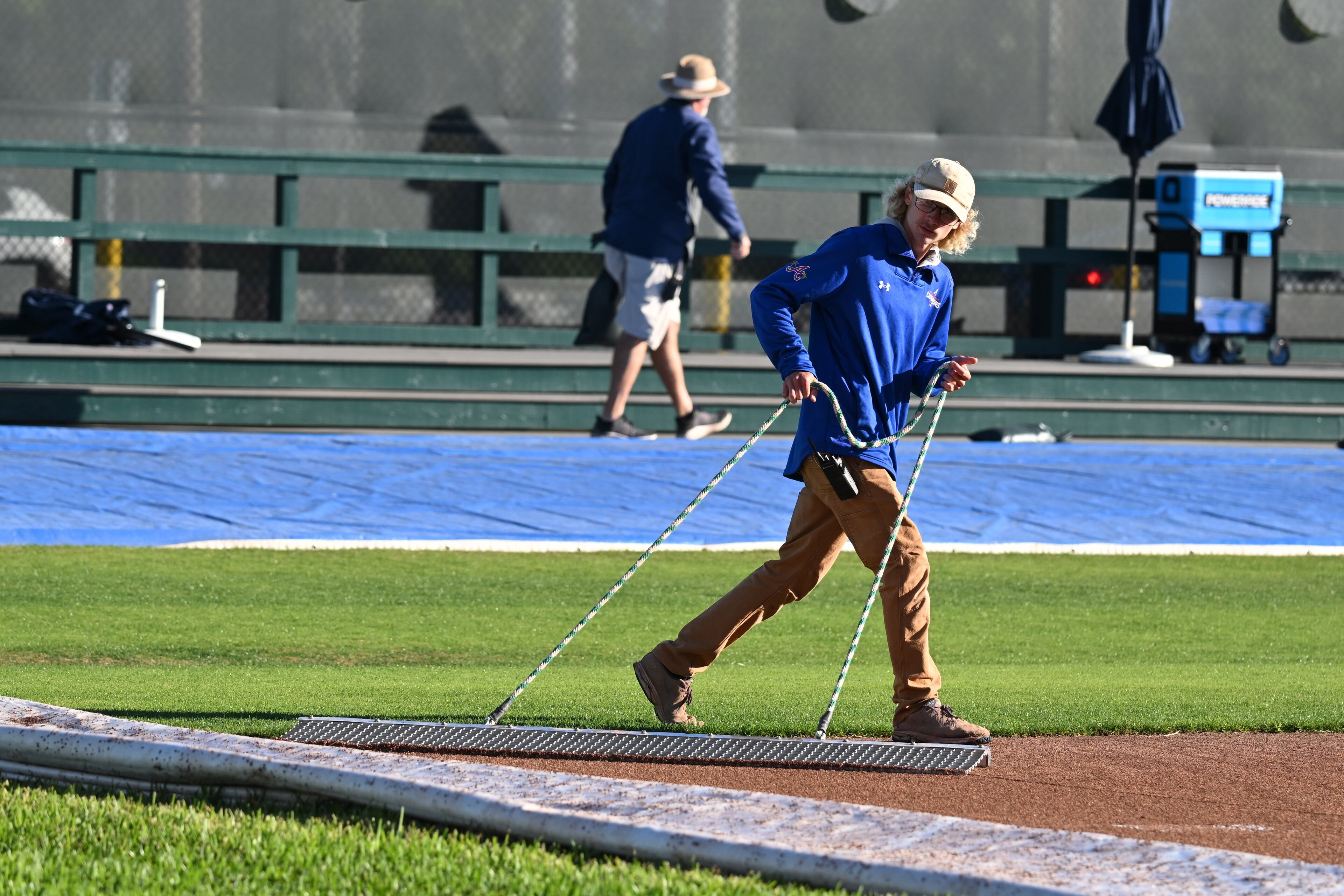 Ground crew work on pitcher mount field on the first day Braves pitchers and catchers reported to spring training at CoolToday Park, Monday, Feb. 13, 2023, in North Port, Fla. (Hyosub Shin / Hyosub.Shin@ajc.com)