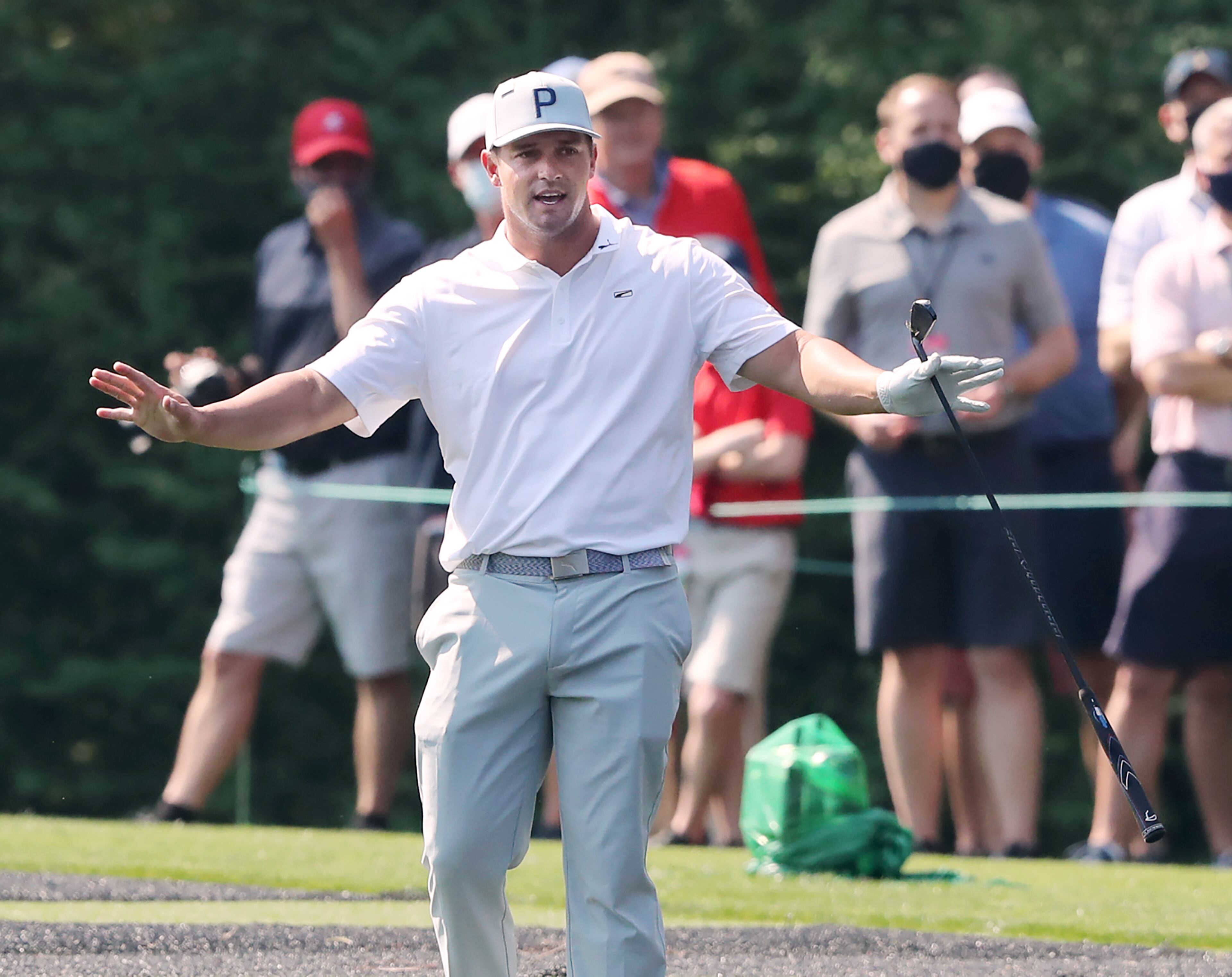 040721 Augusta: Bryson DeChambeau reacts to skipping his ball across the pond to the 16th green during his practice round for the Masters at Augusta National Golf Club on Wednesday, April 7, 2021, in Augusta. “Curtis Compton / Curtis.Compton@ajc.com”