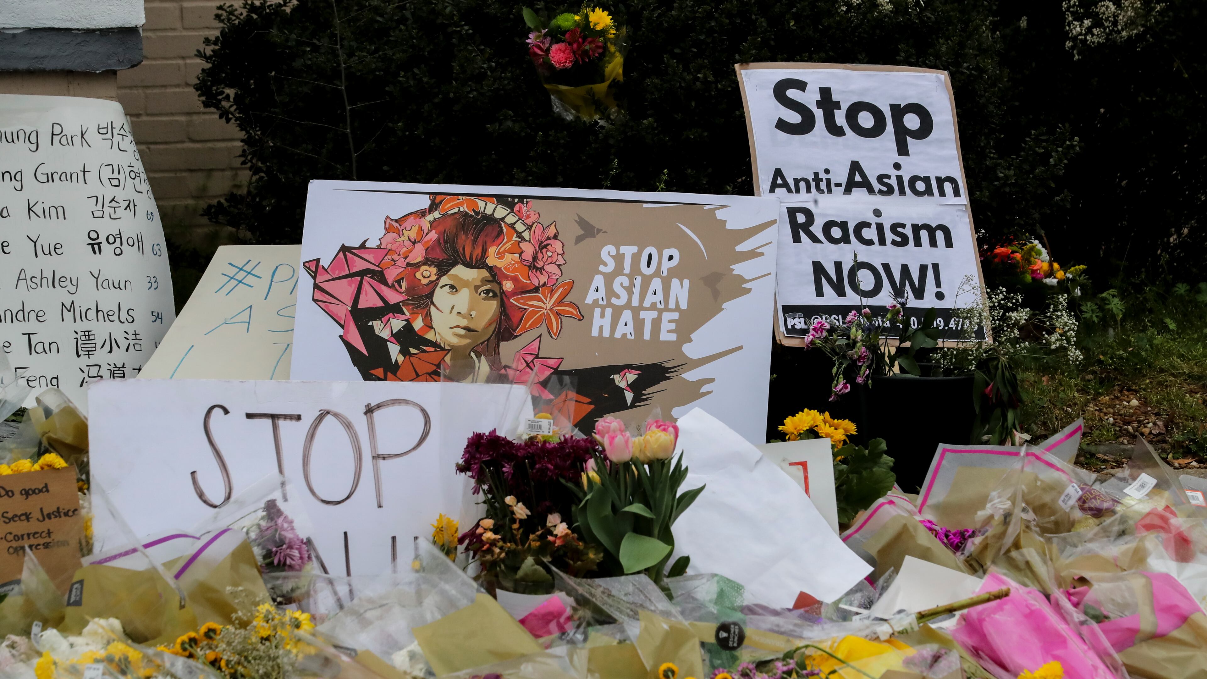 Signs and flowers in front of the Gold Spa on Piedmont Avenue on Wednesday March 24, 2021 in Atlanta. The Gold Spa and Aromatherapy Spa
are located in the 1900 block of Piedmont Road NE in Atlanta, and were two of the three spas eight people were killed at on Tuesday, March 16, 2021. The shootings occurred roughly 30 miles apart at three massage parlors in Cherokee and Fulton counties. 21-year-old Robert Aaron Young from Woodstock was later captured about 150 miles south of Atlanta and is the suspect in three metro Atlanta massage parlor shootings that left eight people dead. Six of the eight victims were Asian women.
(John Spink / John.Spink@ajc.com)