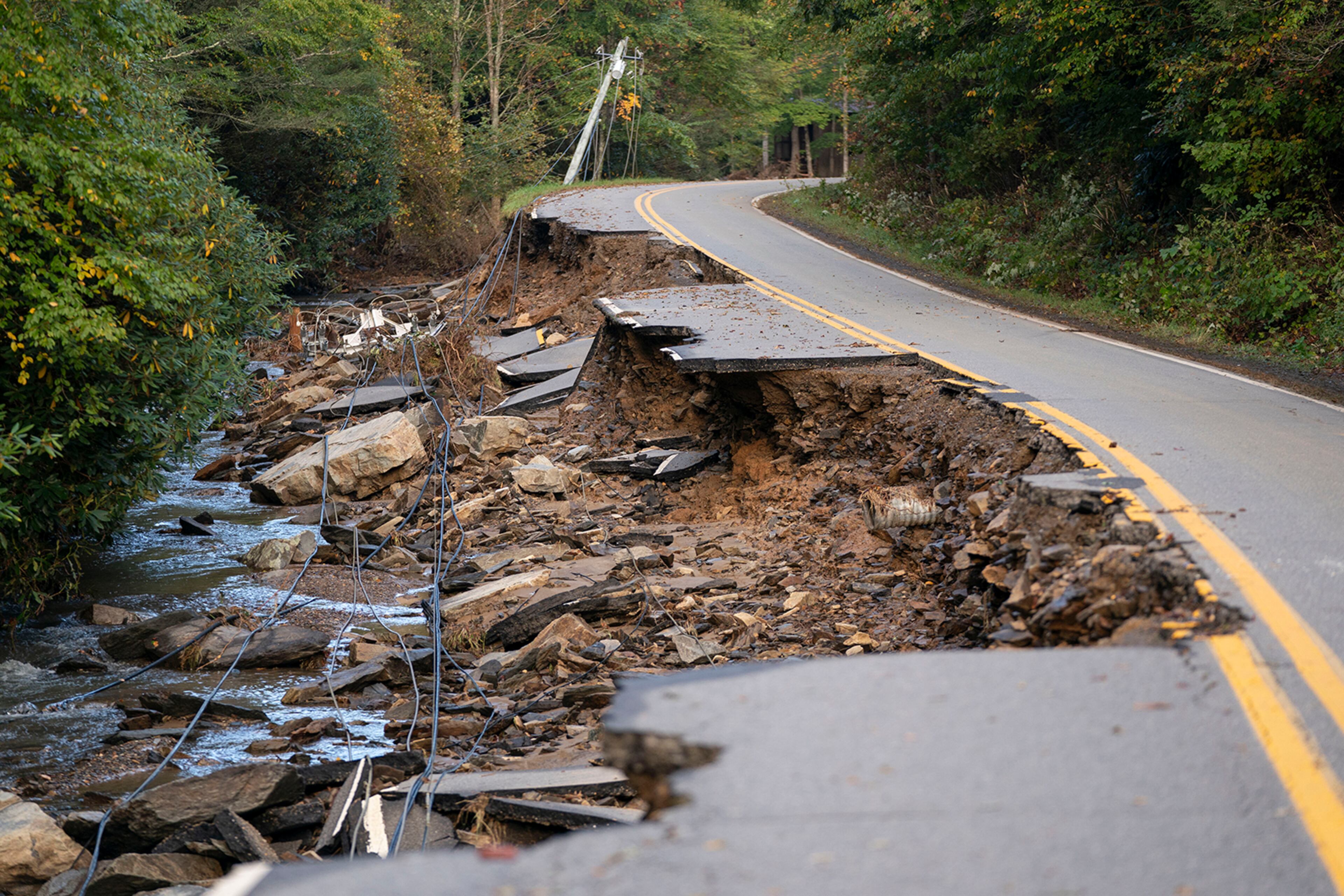 A partially collapsed road in the aftermath of Hurricane Helene in October 2024 near Black Mountain, N.C. (Sean Rayford/TNS 2024)