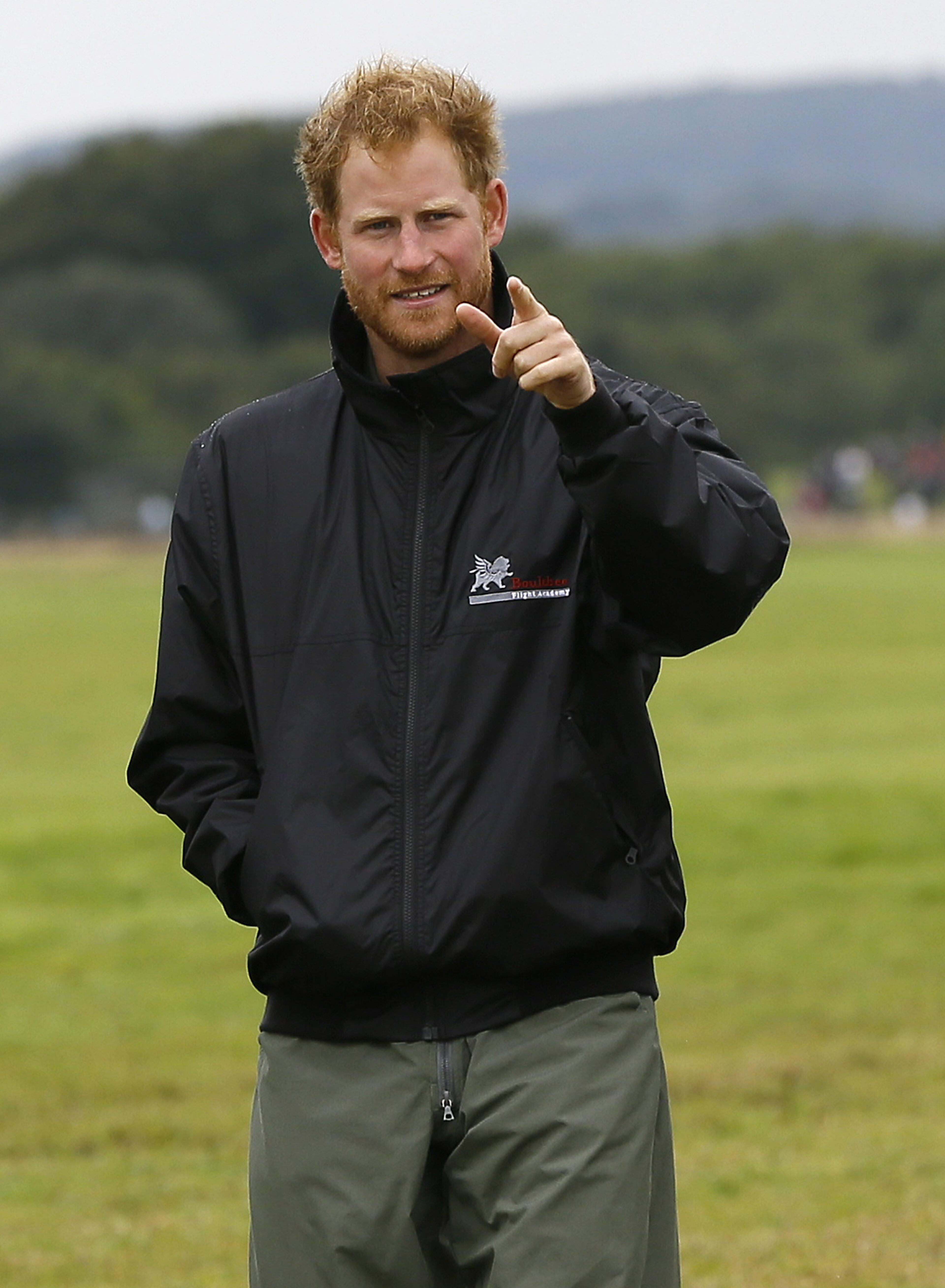 CHICHESTER, ENGLAND - SEPTEMBER 15: Prince Harry walks on the airfield at Goodwood Aerodrome on September 15, 2015 in Chichester, England. The 75th Anniversary of the Battle of Britain is being marked by a historic flypast that brings more Battle of Britain aircraft together than ever before as a show of thanks to 'the few' and the sacrifices they made. (Photo by Kirsty Wigglesworth - Pool/Getty Images)