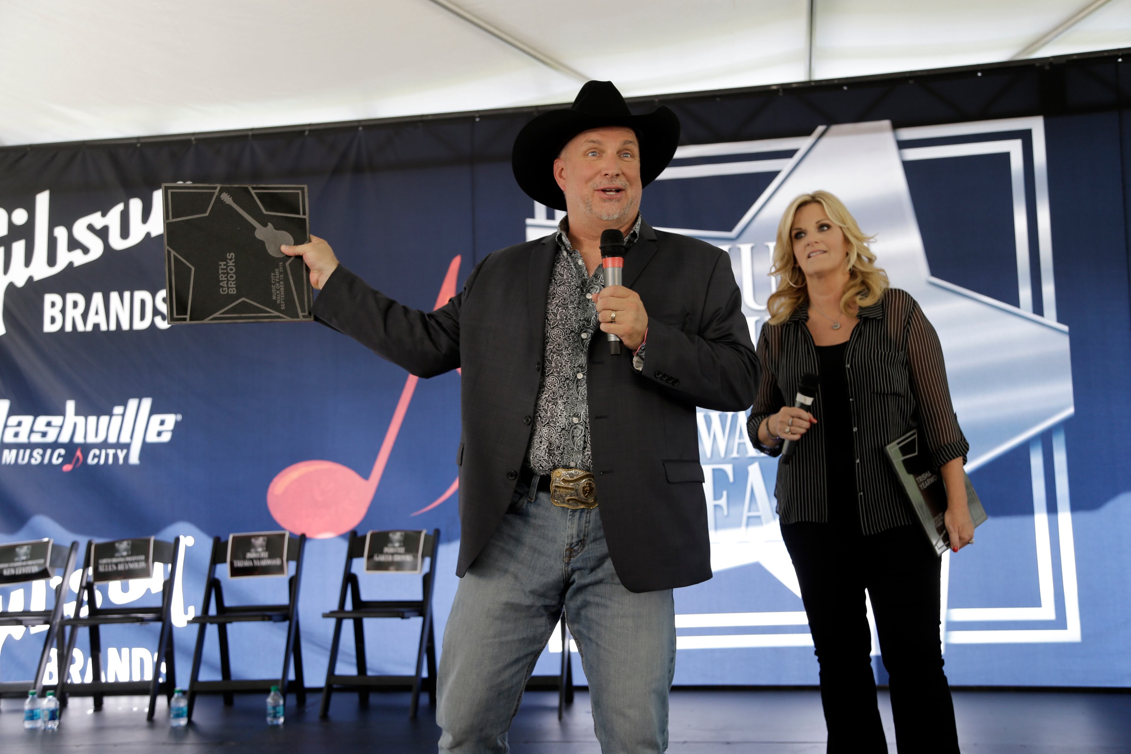 Garth Brooks and Trisha Yearwood speak after receiving stars on the Music City Walk of Fame on Thursday, Sept. 10, 2015, in Nashville, Tenn. (AP Photo/Mark Humphrey)
