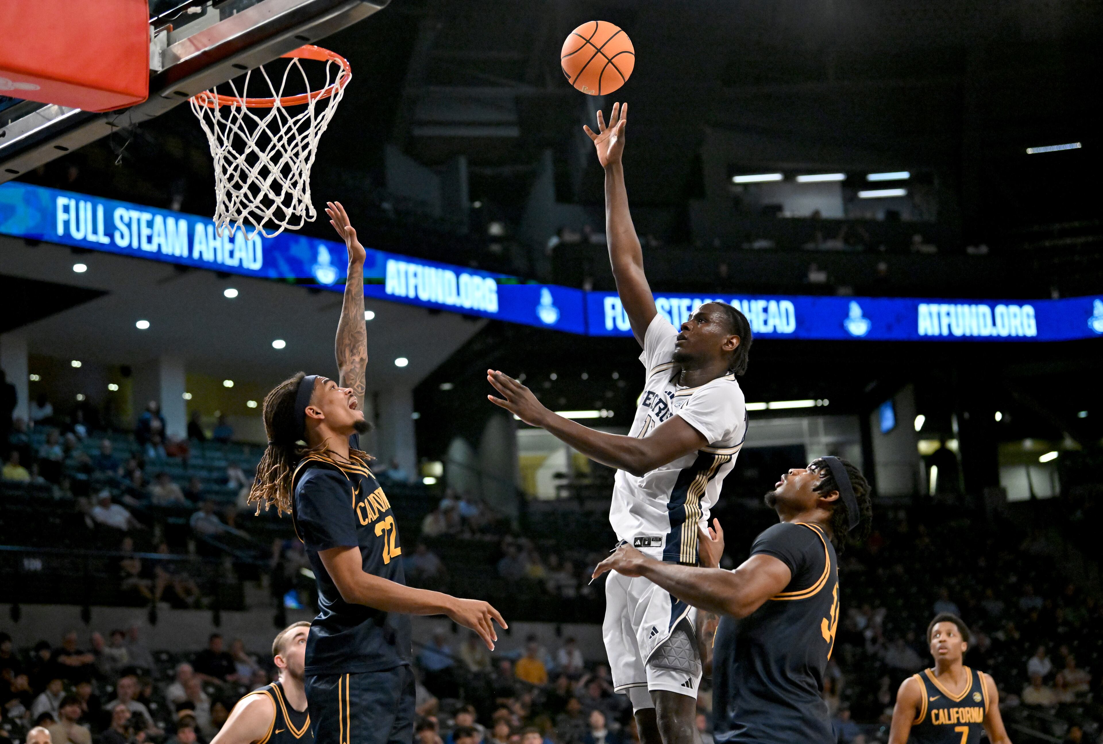 Georgia Tech forward Baye Ndongo (11) shoots over California forward Chris Bell (22) during the second half of an NCAA college basketball game at Georgia Tech’s McCamish Pavilion, Wednesday, March 4, 2026, in Atlanta. California won 76-65 over Georgia Tech. (Hyosub Shin/AJC)