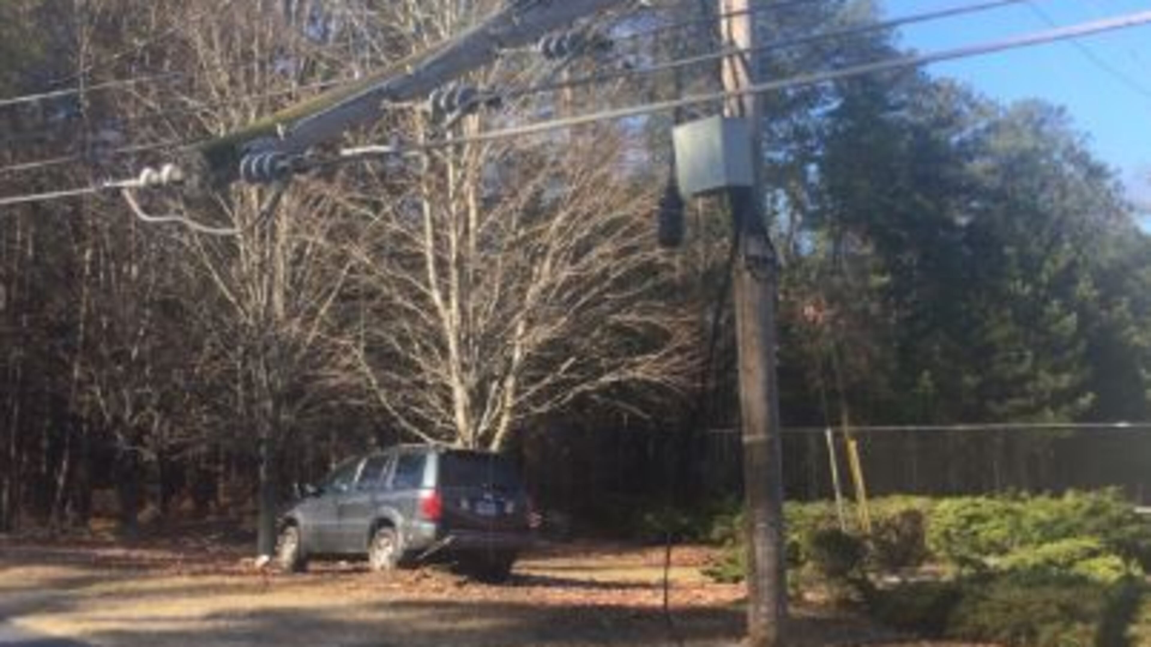 Old Norcross Road in Lawrenceville in Gwinnett County was expected to be closed until 5 or 7 p.m. Saturday after a car slid on ice and a powerline fell.